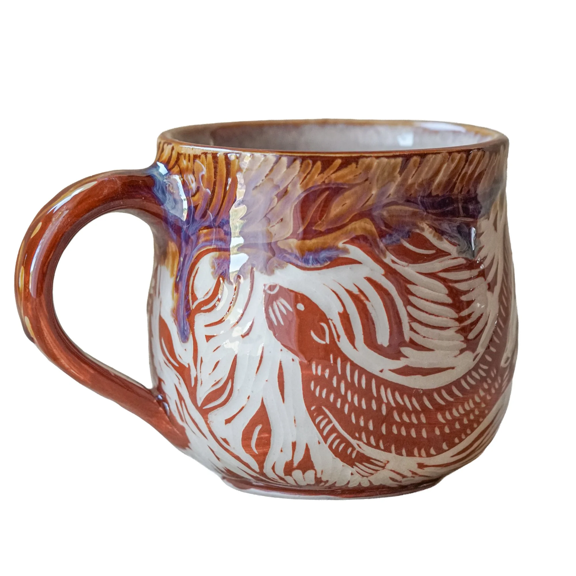 Otter mug - £50. Crafted using the traditional sgraffito carving technique. These pieces are handmade and unique, with similar mugs available from 7th November.