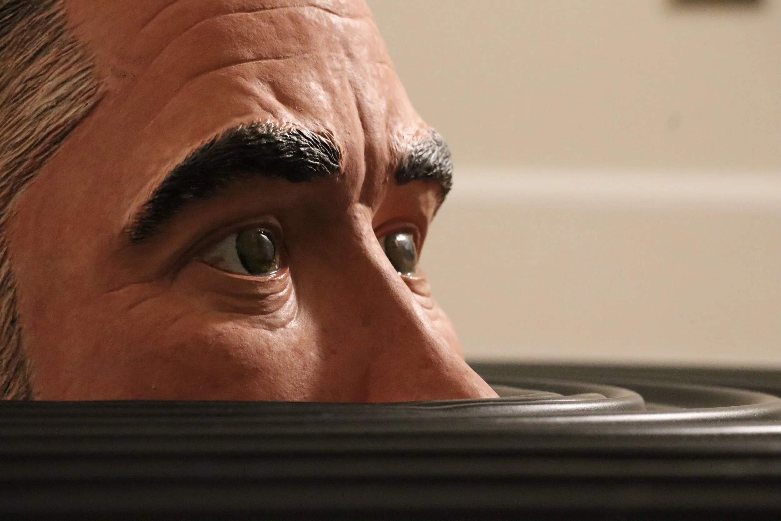 Descending Self Portrait/ Glazed ceramic with paint and polyurethane, on apoxy sculpt, on easy sand 45, on plywood/ 8"x44"x44"/ 2025