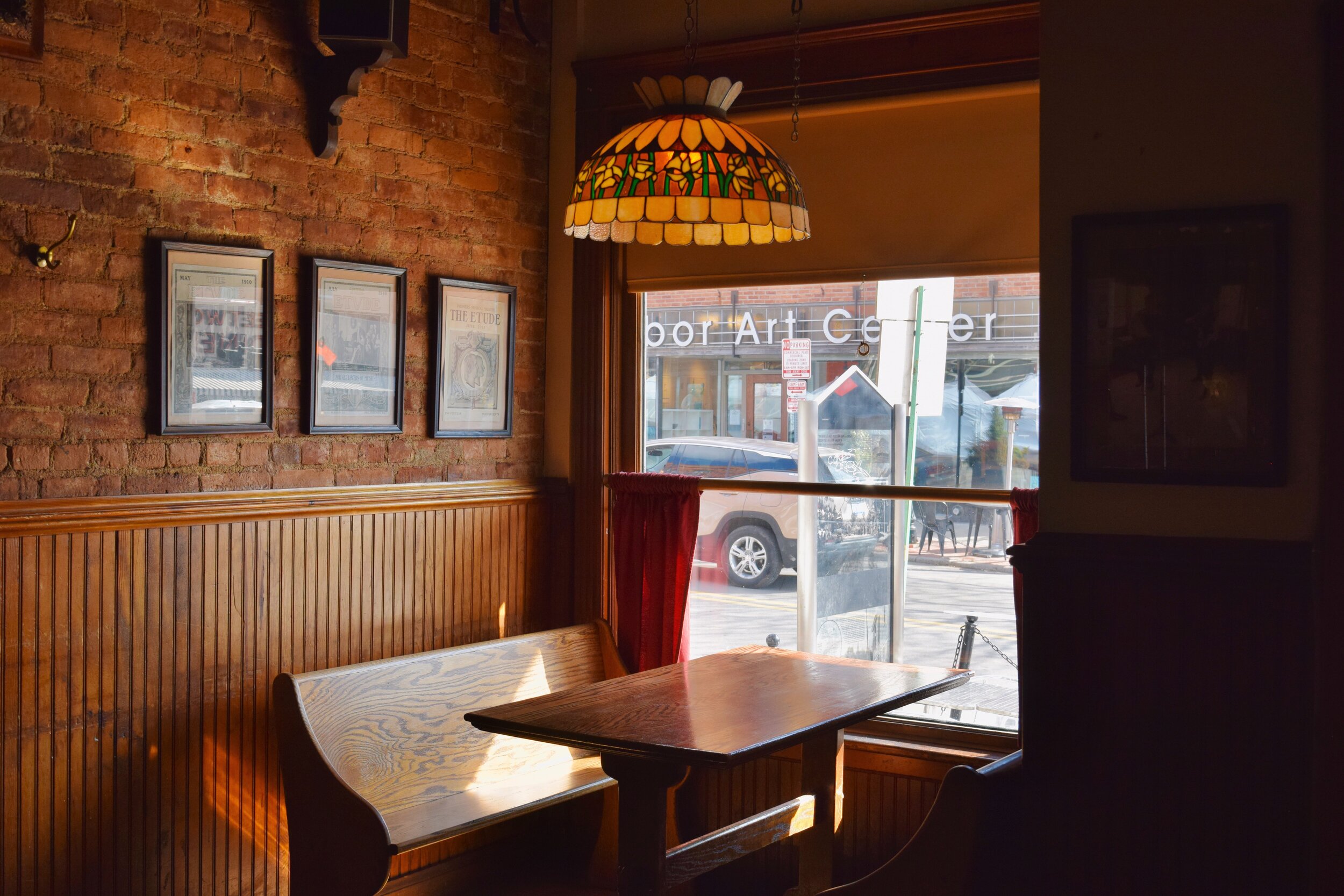 Picture of booth with vintage lights and a window