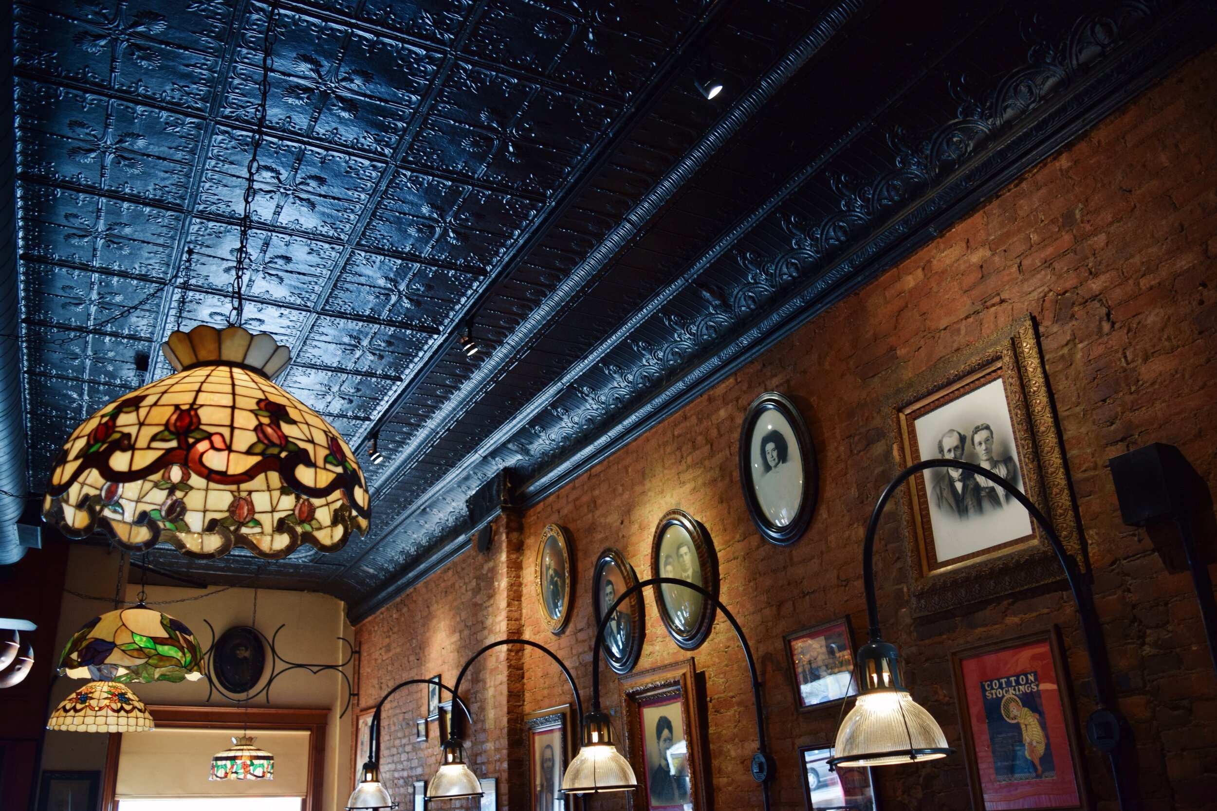 Picture of ornate ceiling, gallery wall, and light fixtures