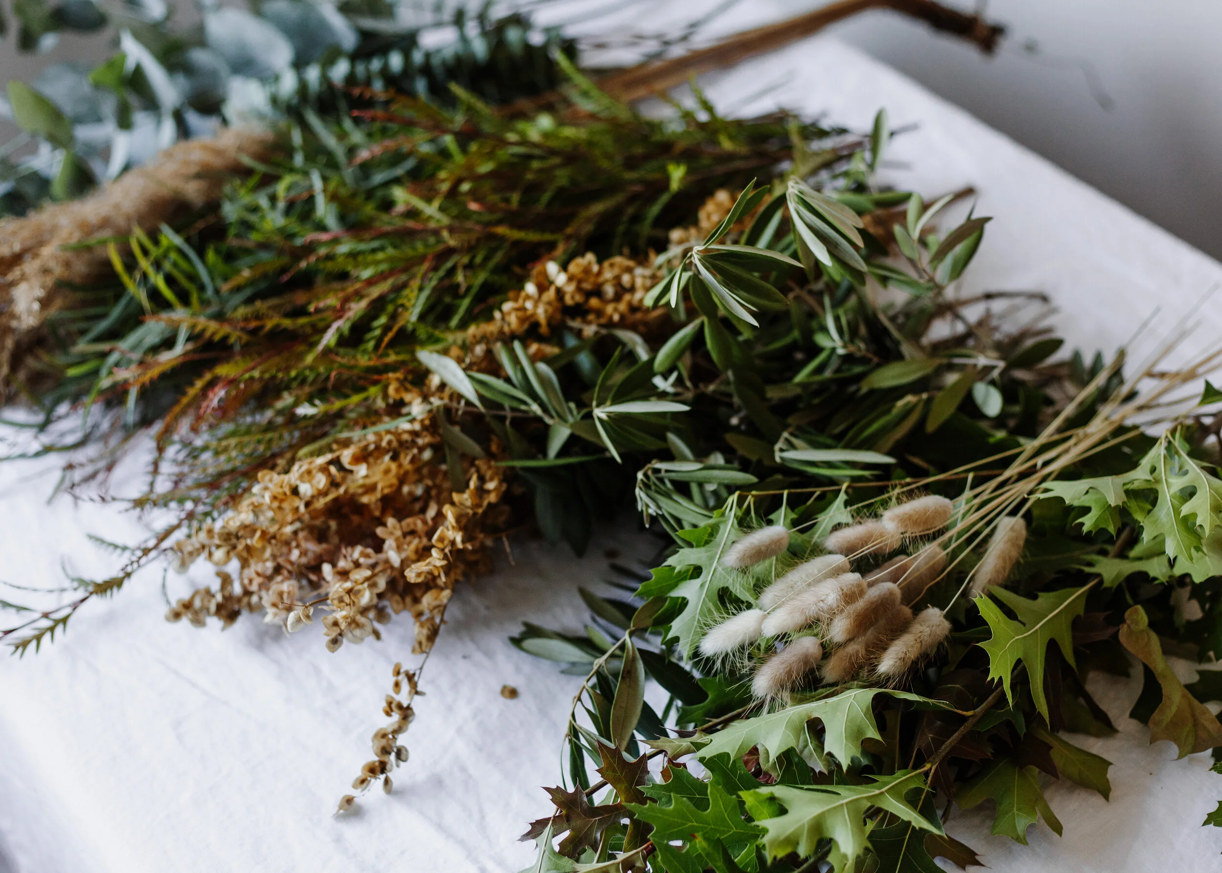 Your kit will most likely include the following foliage; different types of eucalyptus, olive branch, grevillea, oak leaves. The dried elements I love using the most are Atriplex (grown here in Kelowna), Pampas grass and Bunny tails. All of these ingredients make for a perfect everlasting design as they dry beautifully.