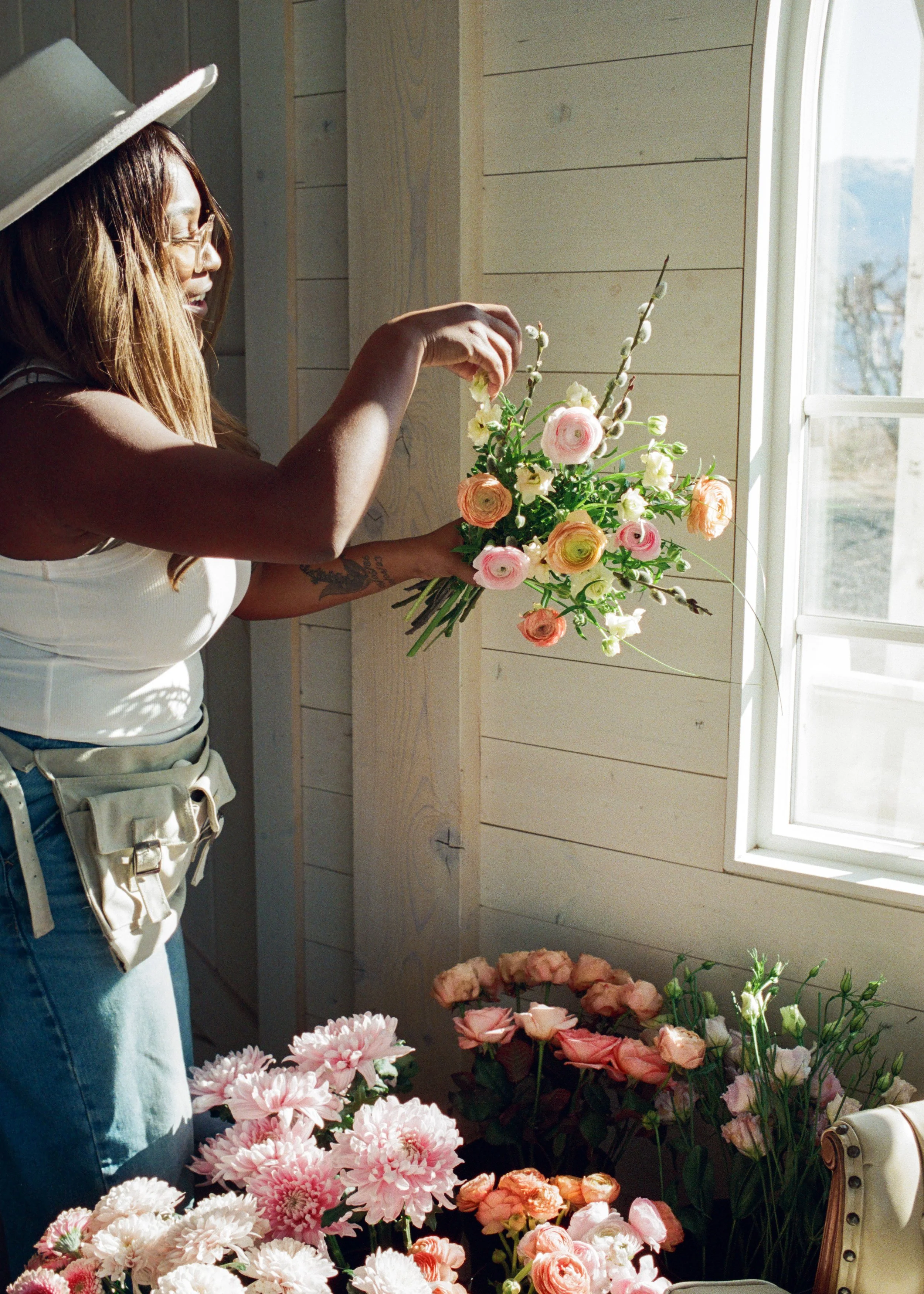 Preparing a seasonal bouquet with fresh farm-grown flowers