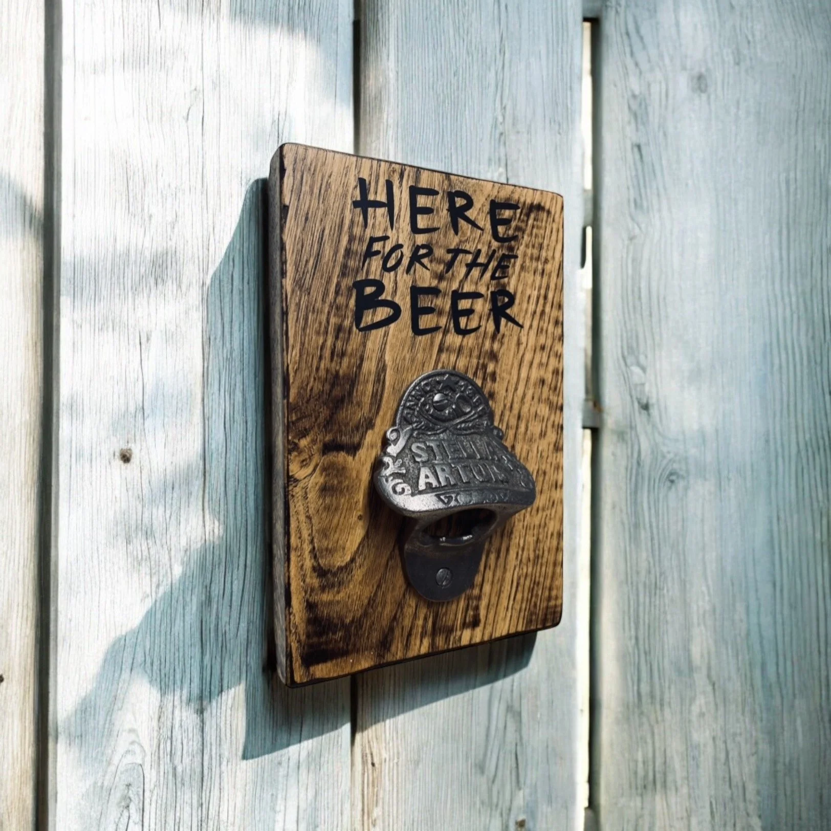 'Stella Artois' ~ 'Here for the Beer' or 'Cheers!'
