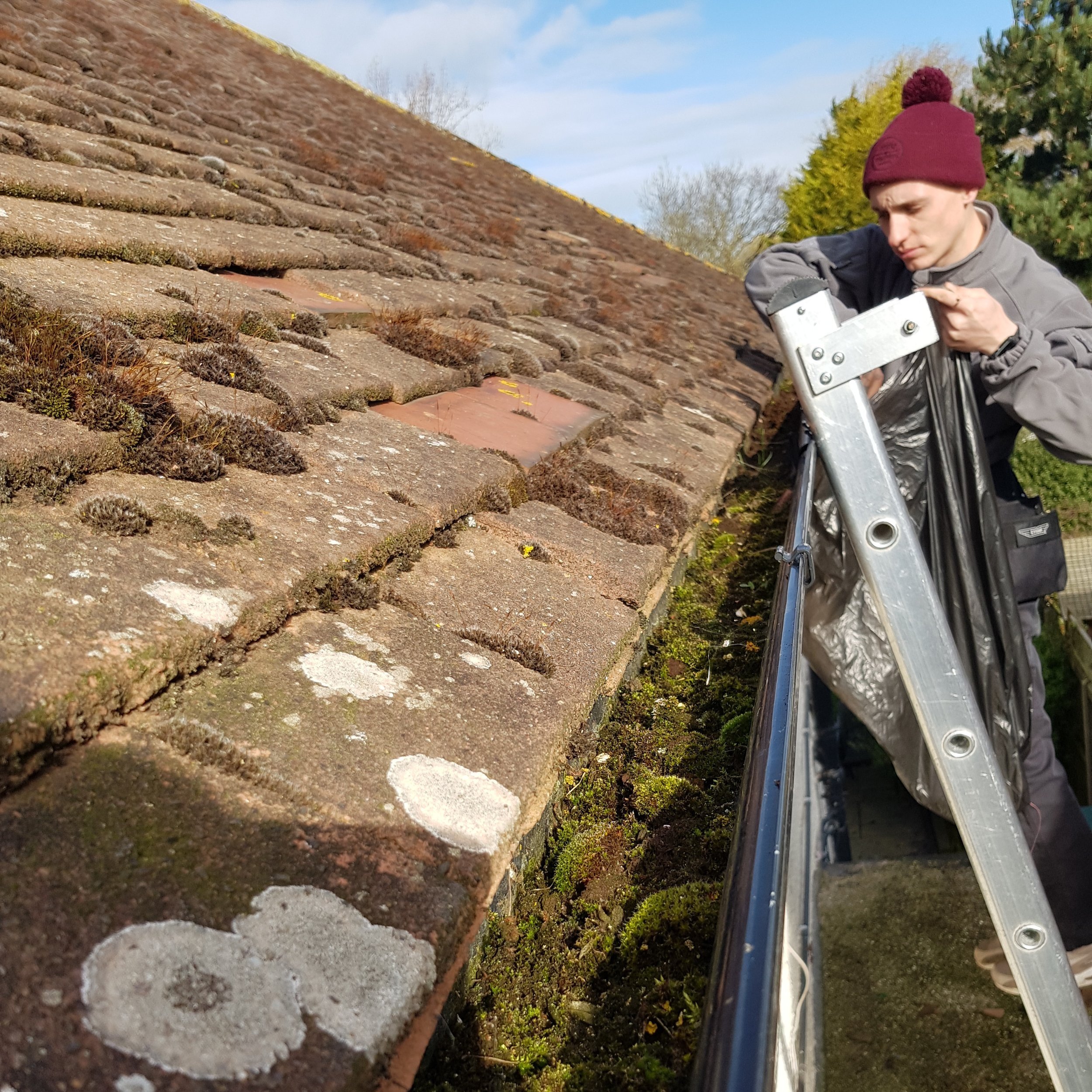 Gutter being cleared traditionally (during)