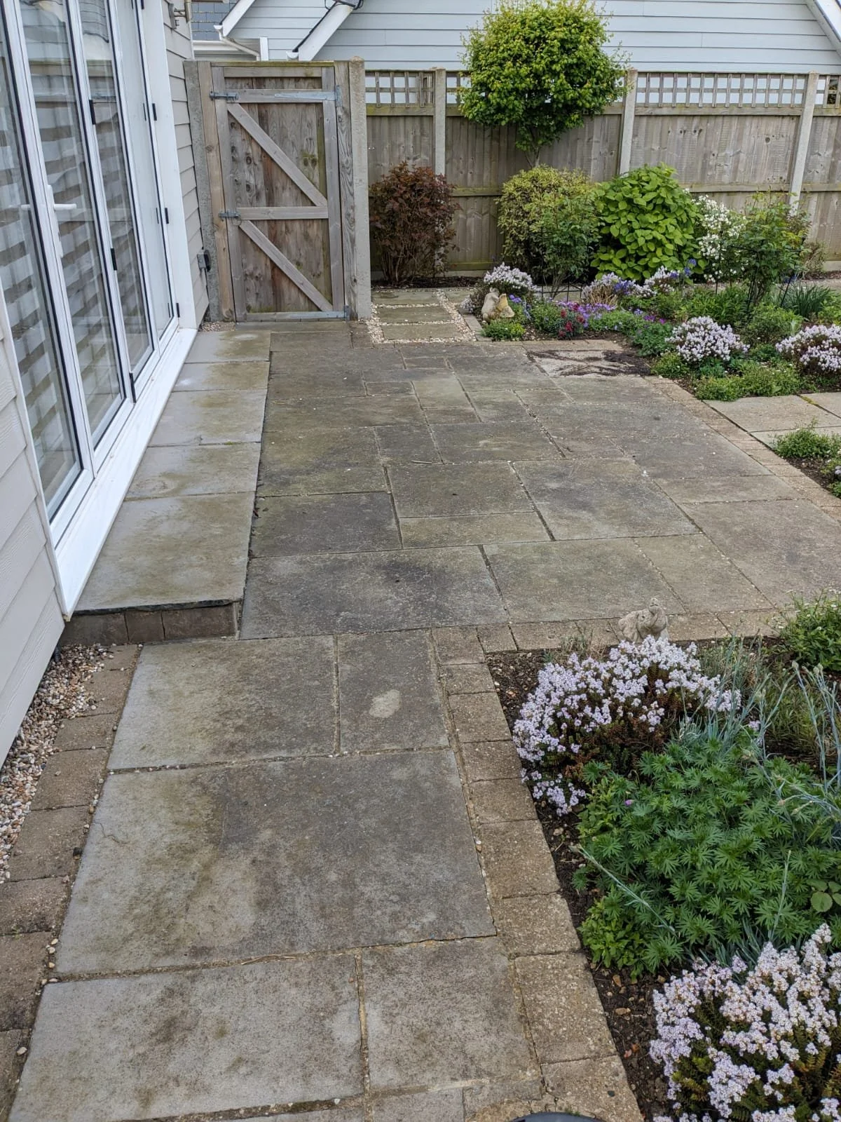 Stone patio before pressure washing