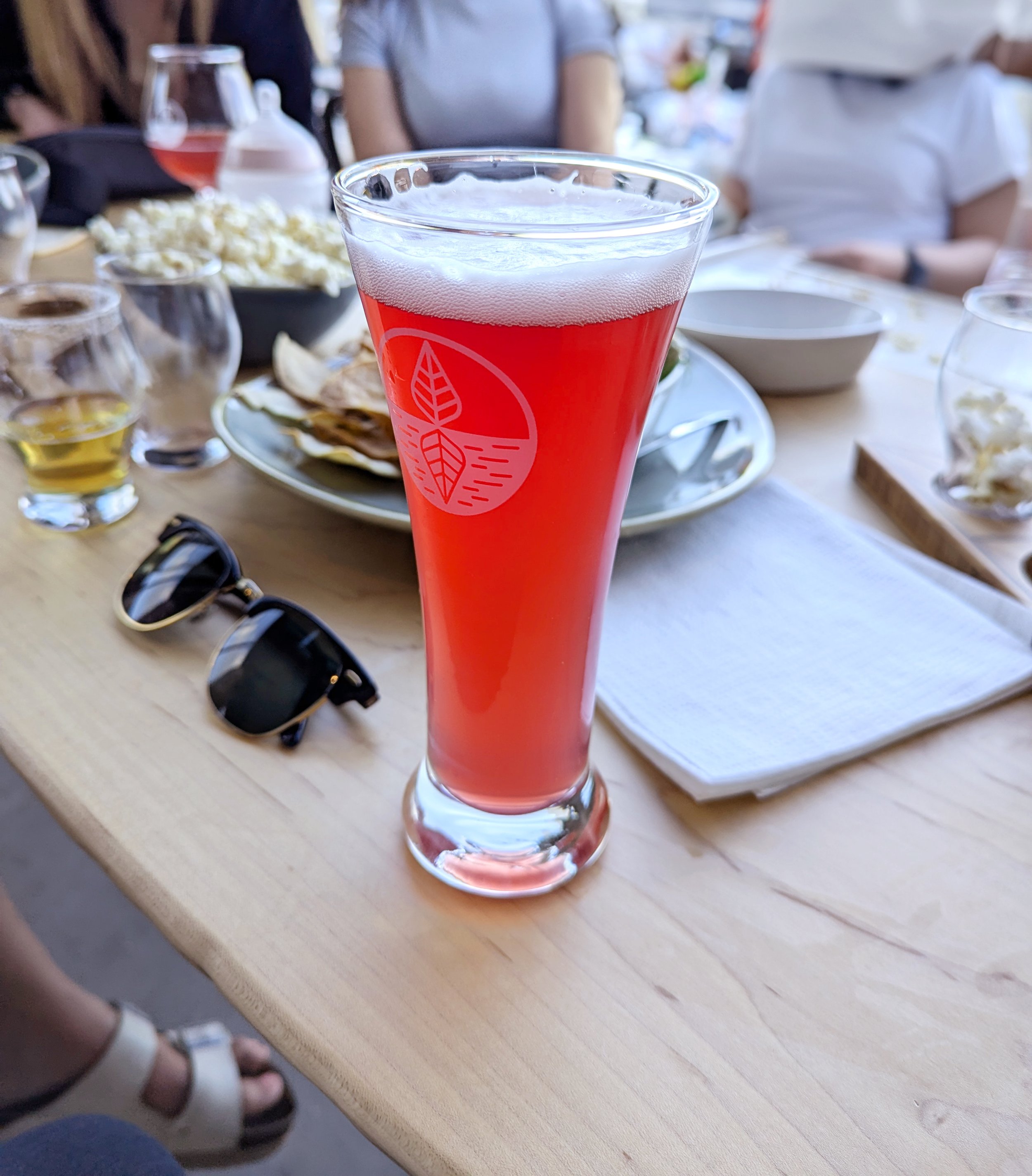 A glass of their delicious hibiscus sour.
