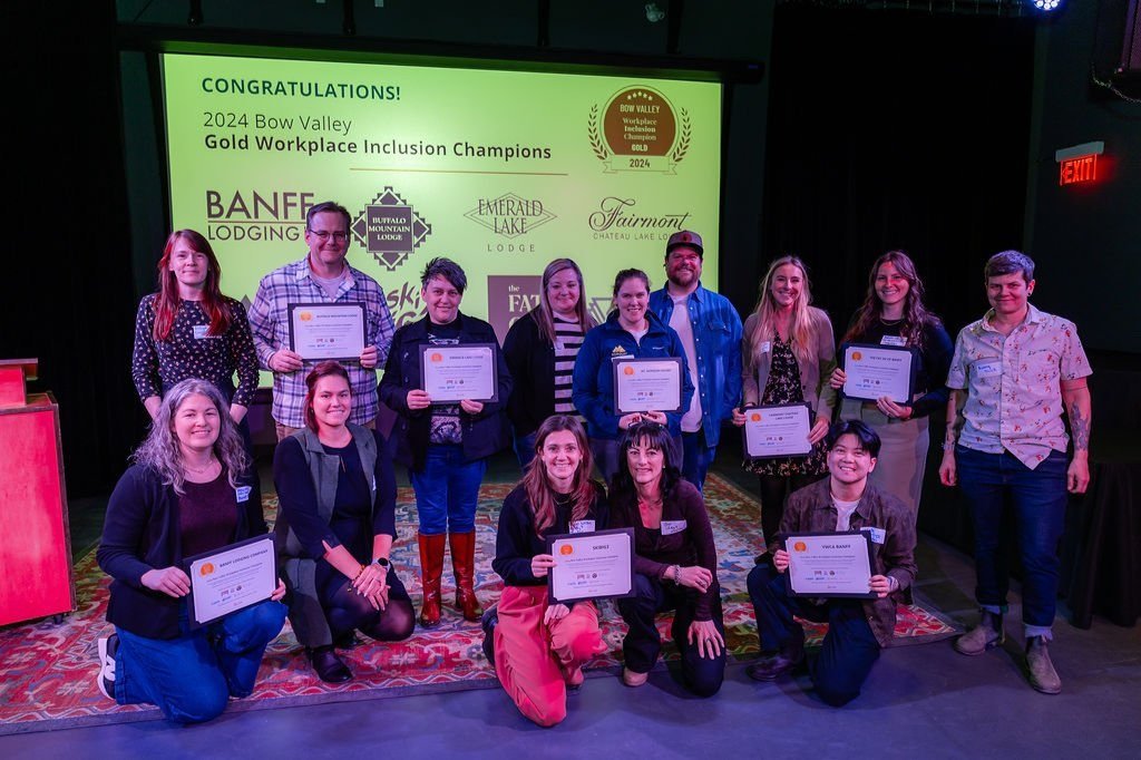 People holding certificates and smiling