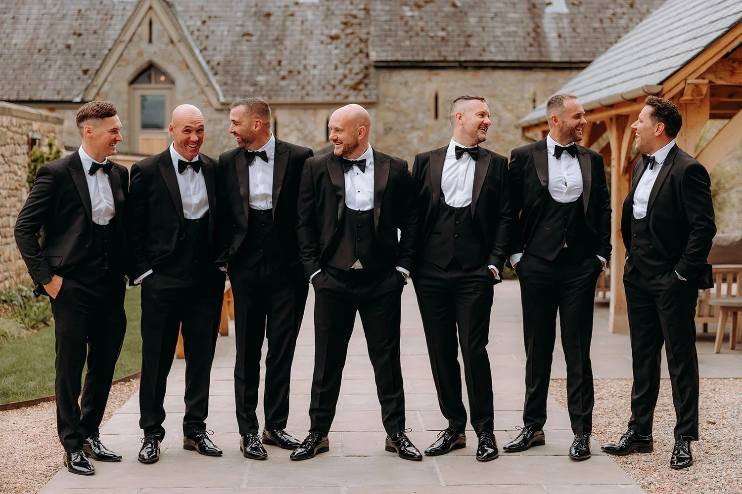 Groomsmen outside the rustic buildings at Wyresdale Park