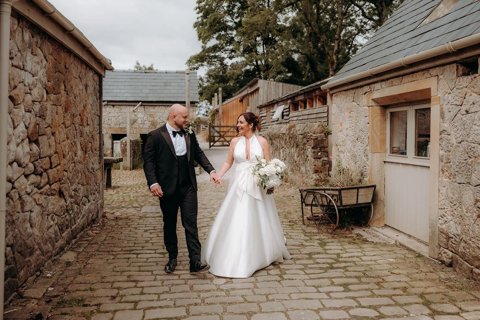 Newly married couple walking through Wyresdale Park in Lancashire