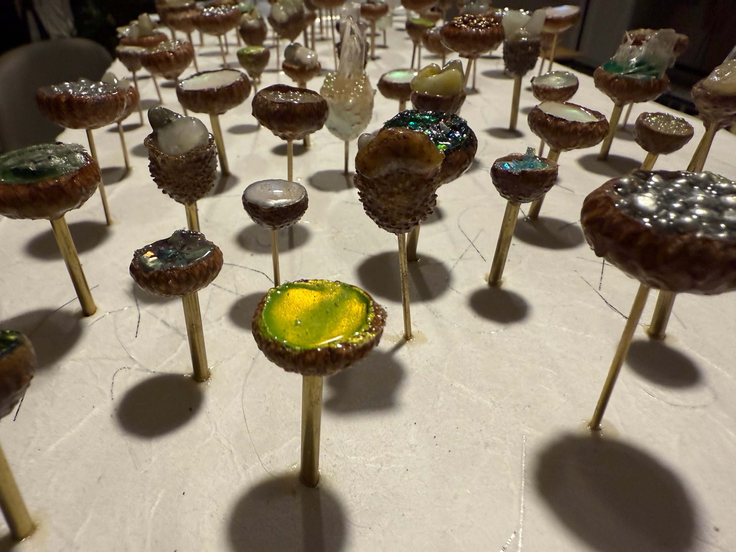 "Treasures in the Fairy's Canopy" invites you to visualize taking a walk through a fairy's forest where treasure filled acorn caps are trees.