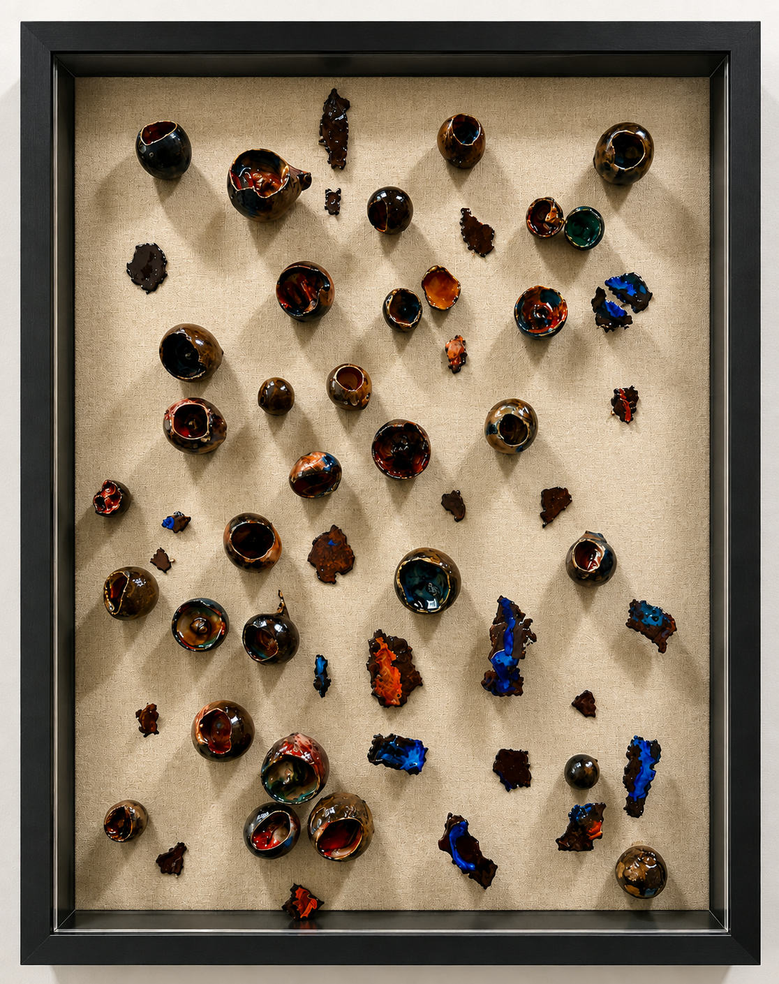 This sculptural relief explores the quiet tension between organic form, texture, and color. Set against natural linen, a collection of biophilla elements and irregular iron fragments are arranged in an intentionally scattered composition, creating a 