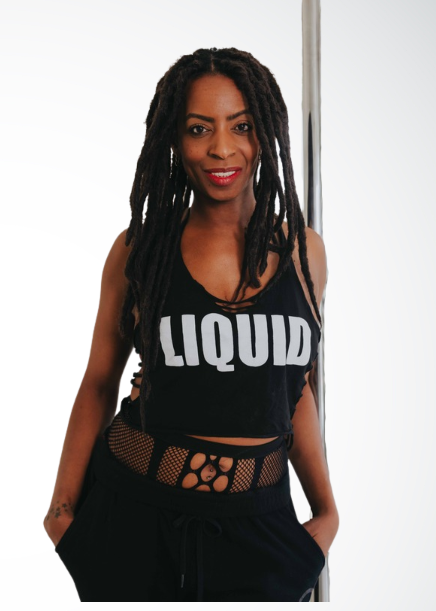 Tamara-Star, pole and floorwork instructor at Full Circle Brooklyn, demonstrating fluid freestyle pole movement in NYC