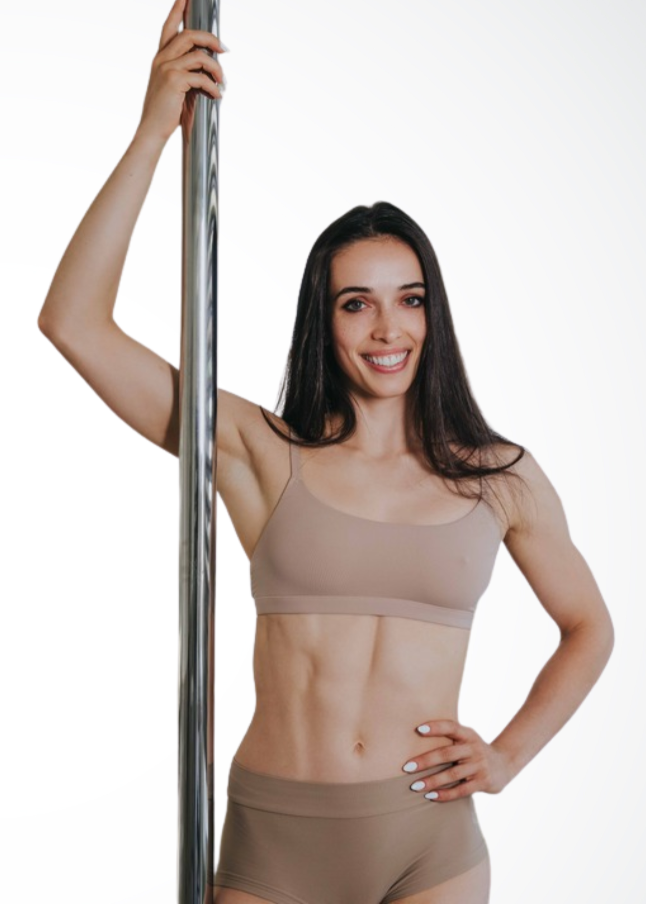 Gina, pole instructor at Full Circle Harlem, demonstrating strong and artistic pole dance movement in NYC