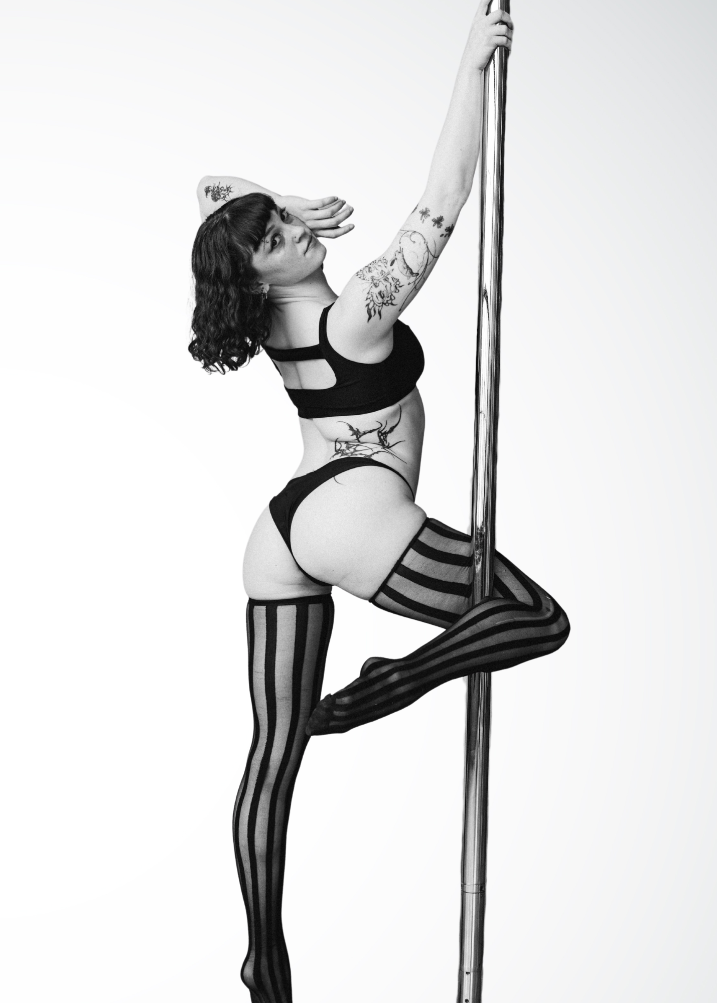 Cam pole instructor and performer in Brooklyn showcasing contemporary pole movement and transitions