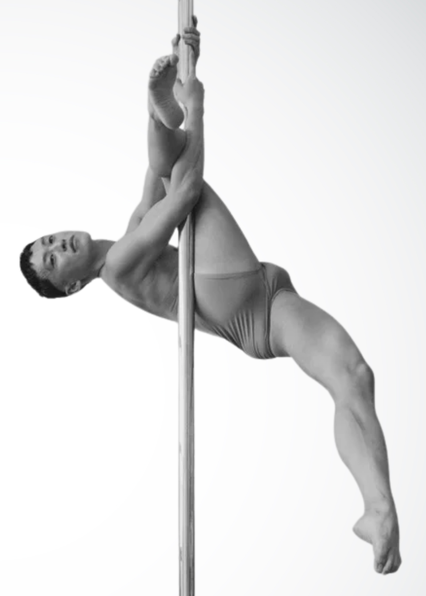 Evan pole instructor in NYC demonstrating playful and expressive pole movement at Full Circle