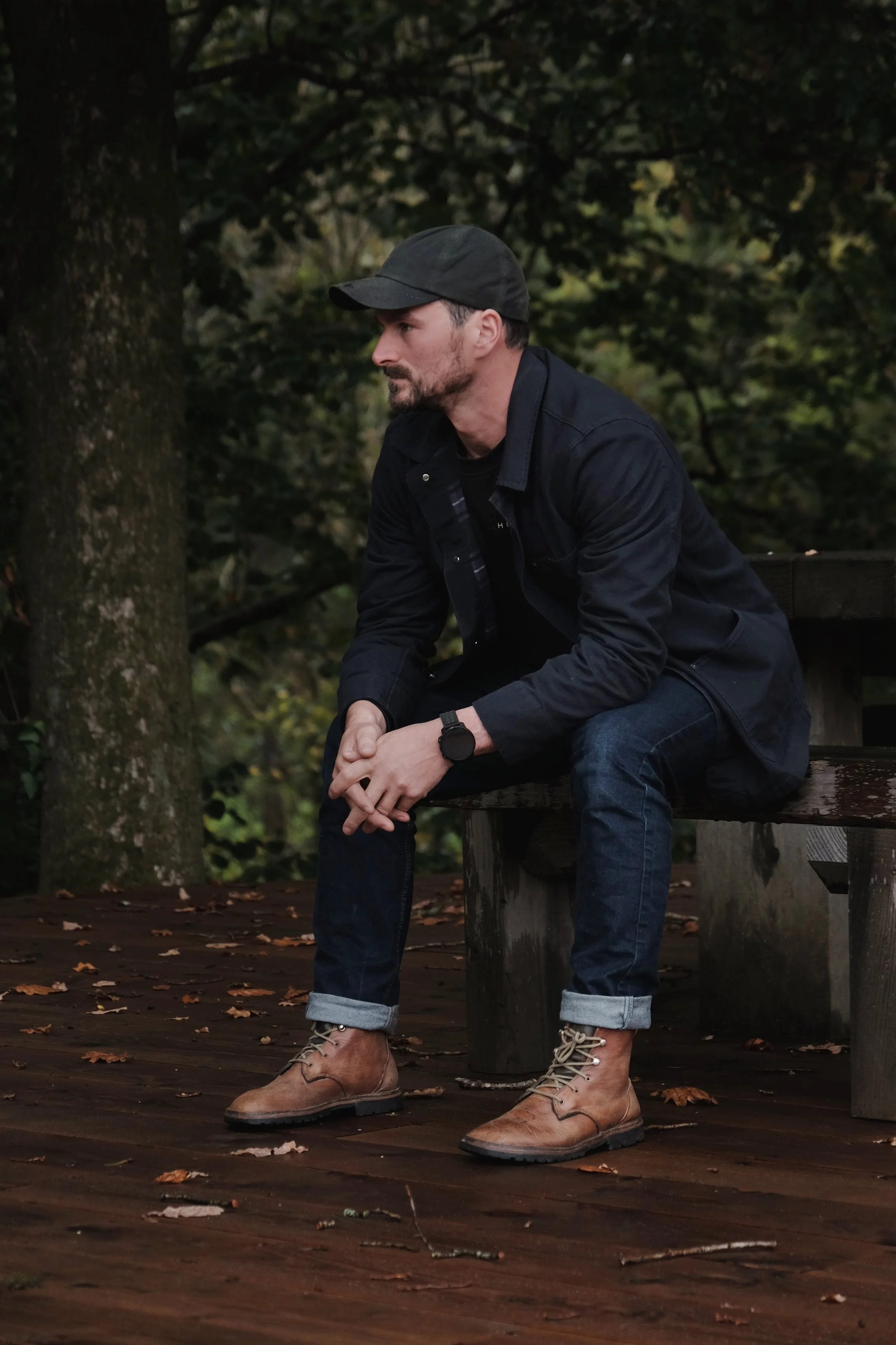 Olly Davey sat in the woods