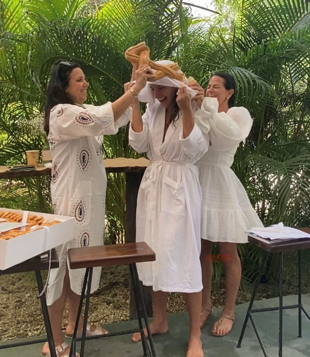 Rachel sheff and Denisse Levy breaking Ka’ak over bride Estrella Levy Sheff’s head.