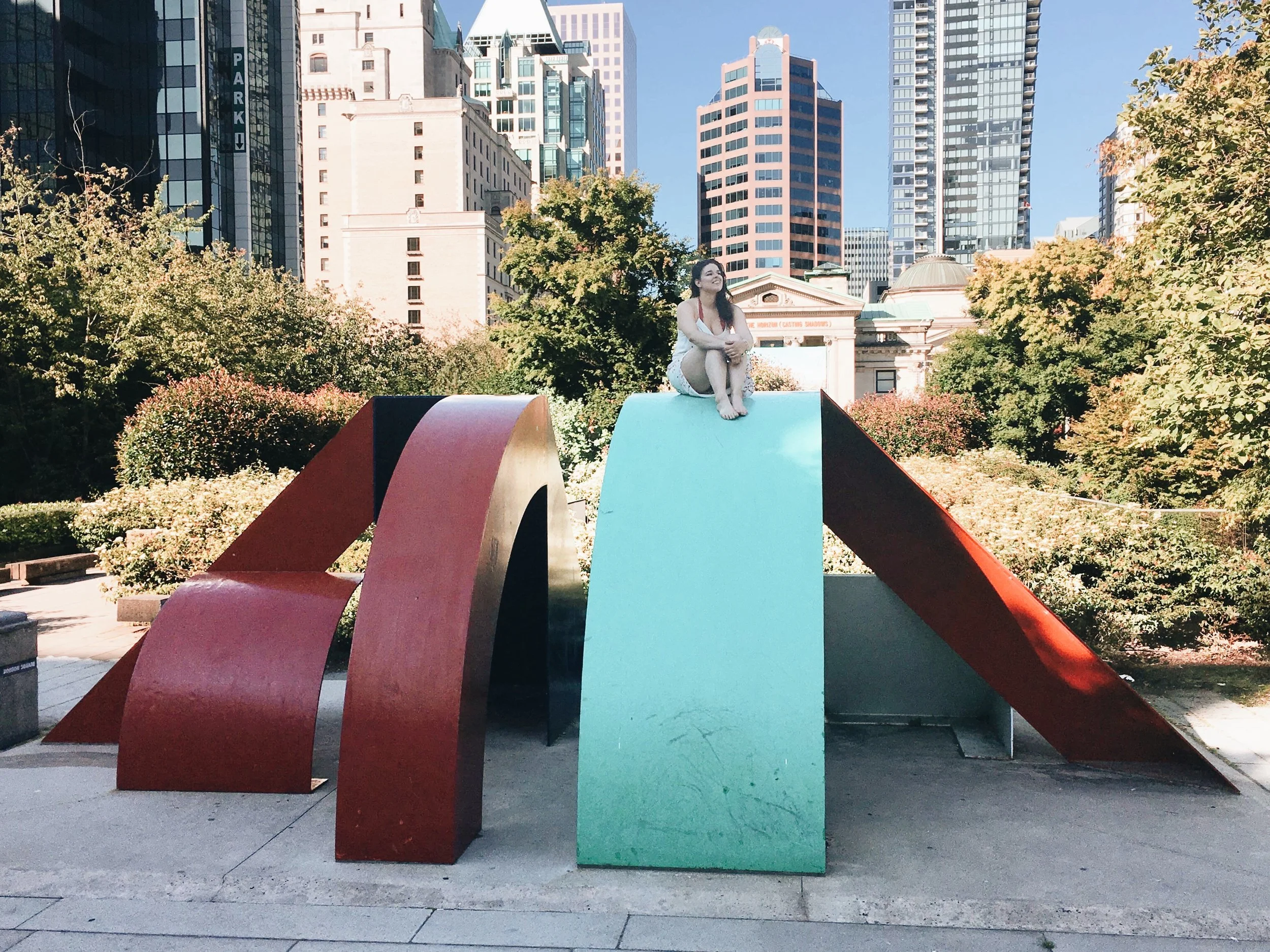 woman connecting with nature in a park in downtown