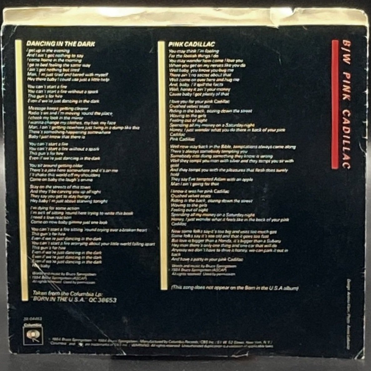 The front, back, and any gatefold views of the single Bruce Springsteen - Dancing In The Dark (7" Single)