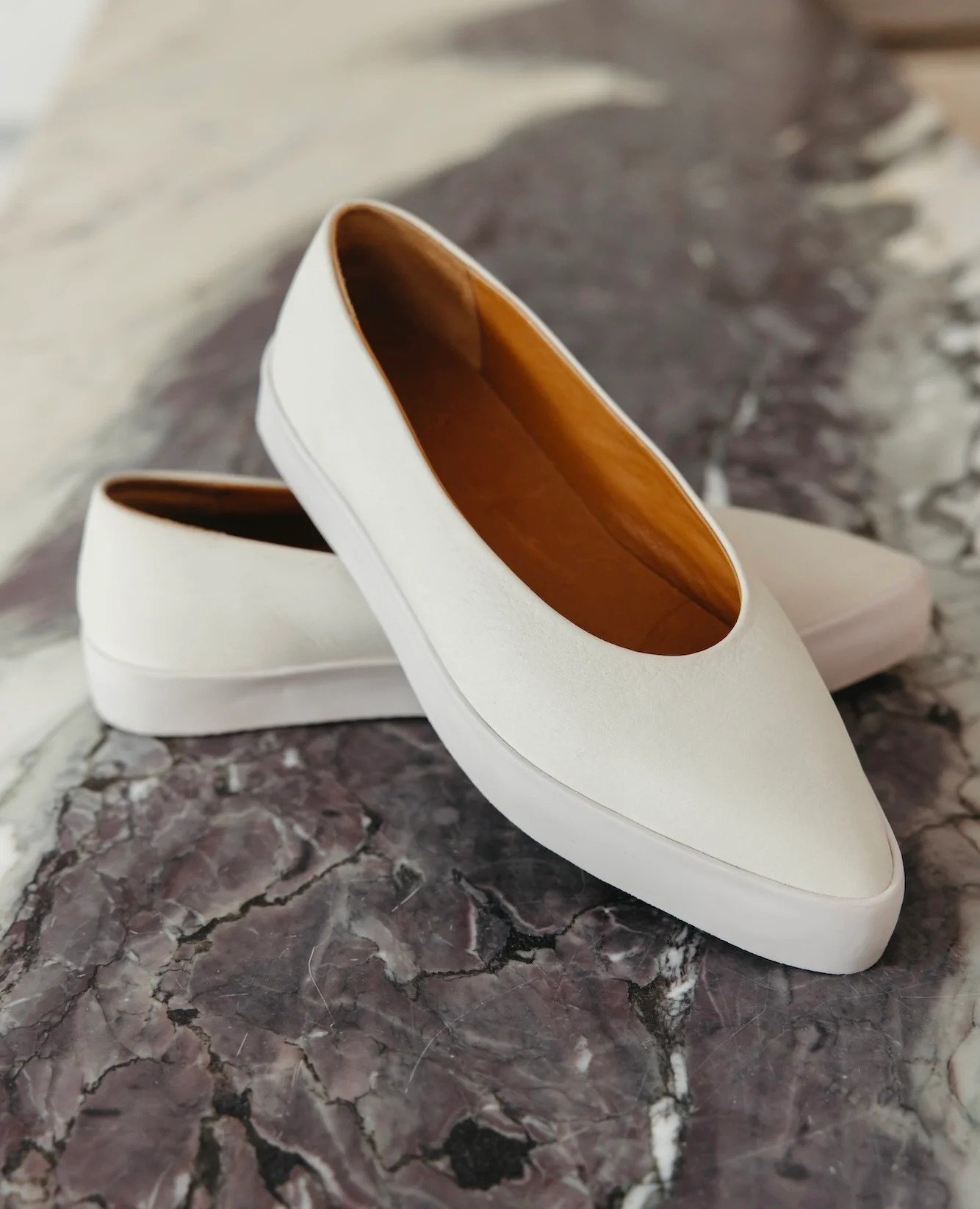 New footwear Friday: the Regal slip-on by Coclico, a sleek, pointed-toe suede flat in the most perfect neutral greige. In-stock now at Deborah Kent's South Tampa. Shop in-store today until 5:30 or online anytime at the link in our bio.