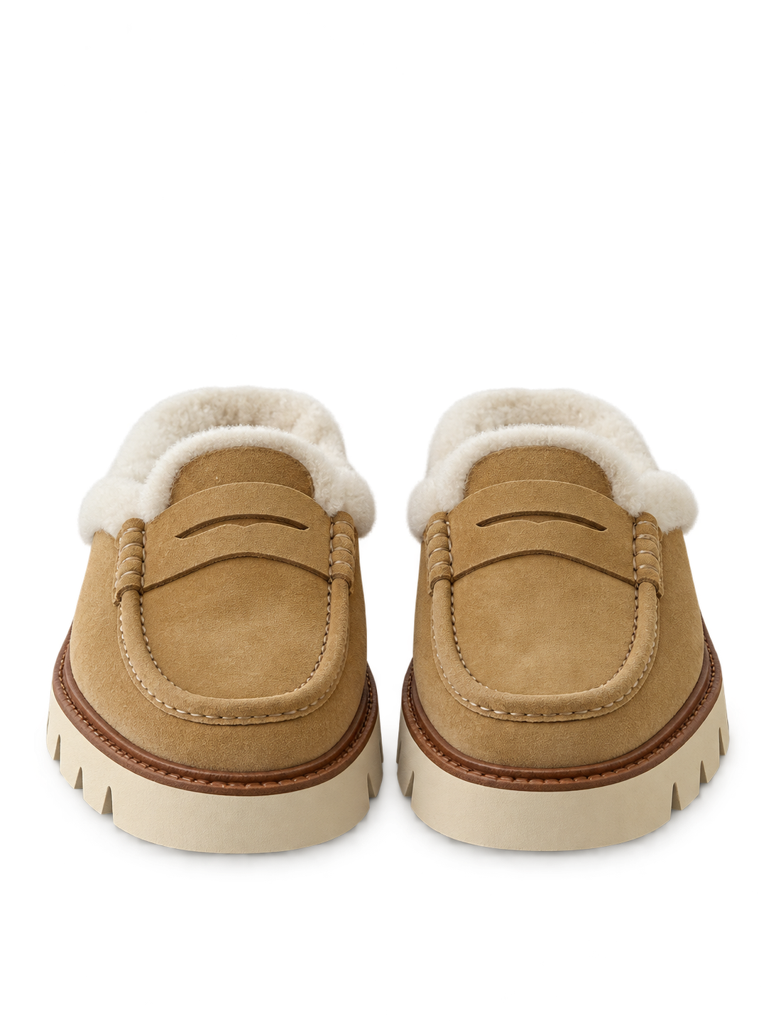 Shearling-lined tan penny mules.png