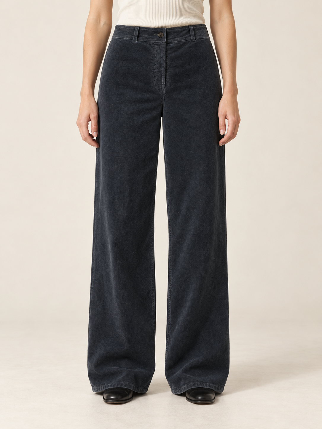 Luxury charcoal trousers on model.png