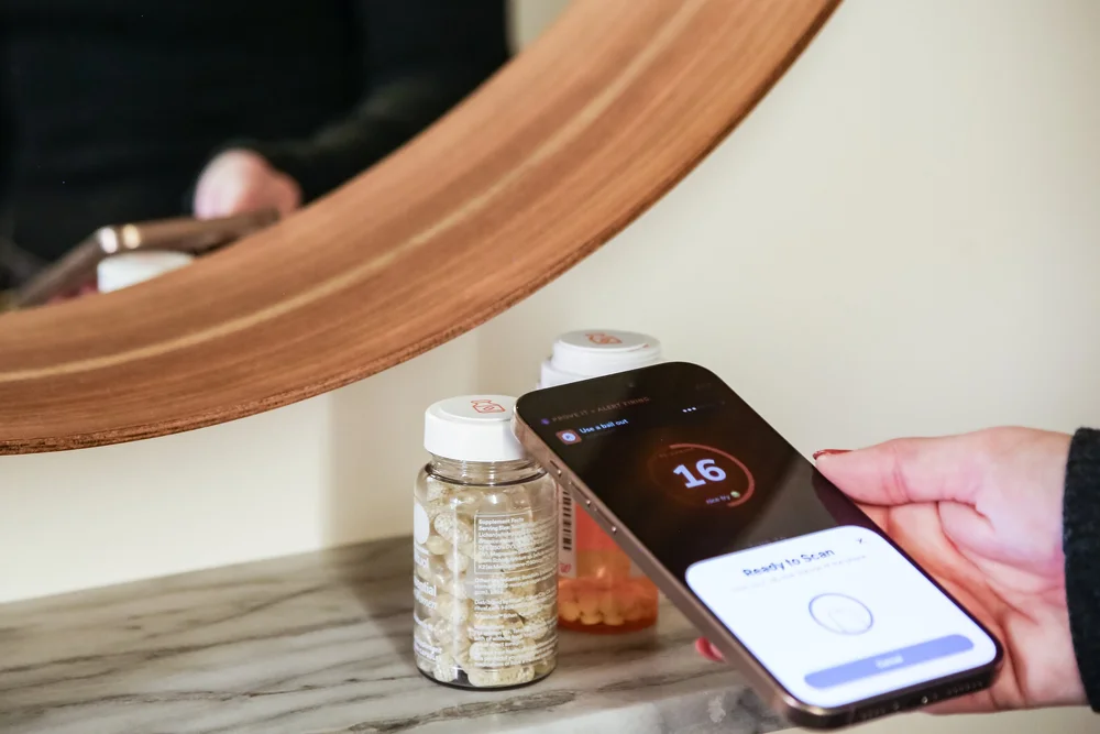 A PROVE IT meds alert firing on a phone by the bathroom mirror