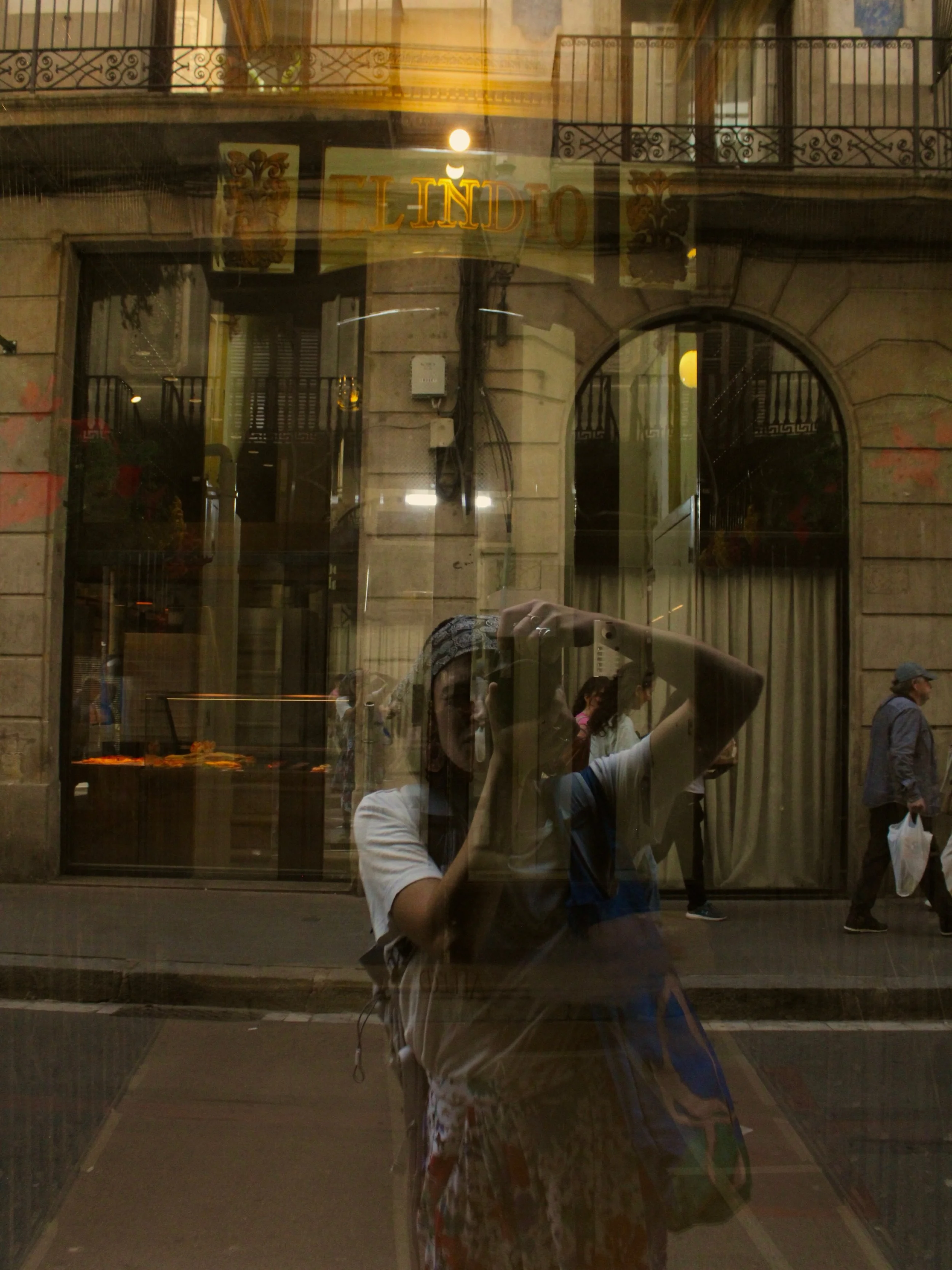 reflections of myself in everything I see 
quiet corners &amp; crowds 
the streets move endlessly 

time stands still behind the lens
listening to lovers &amp; friends fight 
through the night, the day, the sun gleams down 
wanderings &amp; wondering
