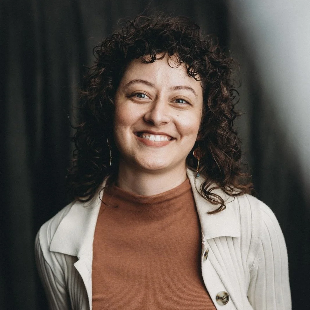 Woman with curly hair smiling