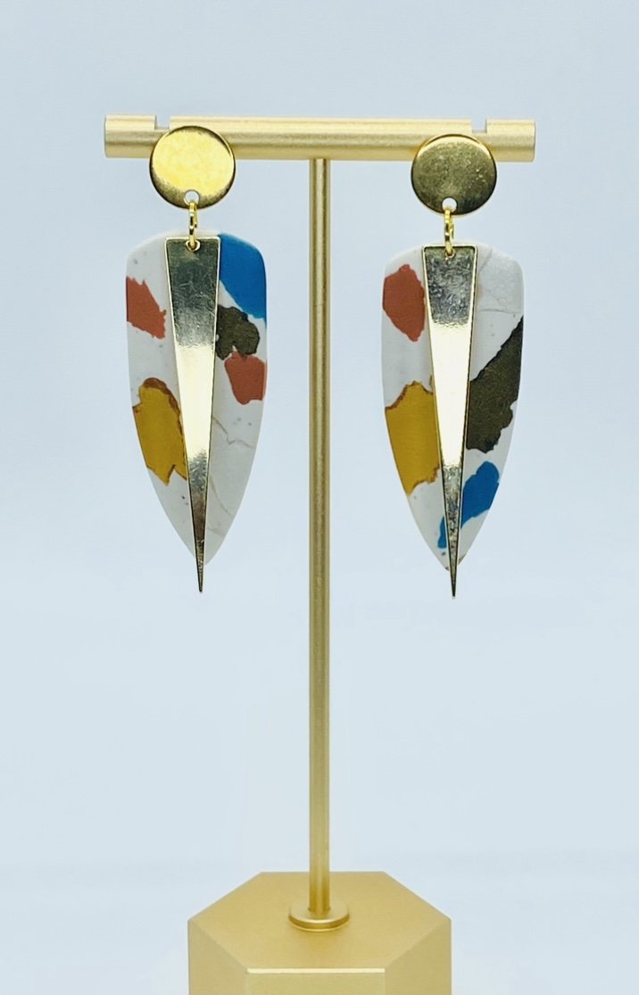 Polymer clay Colorful geometric earrings on a display stand