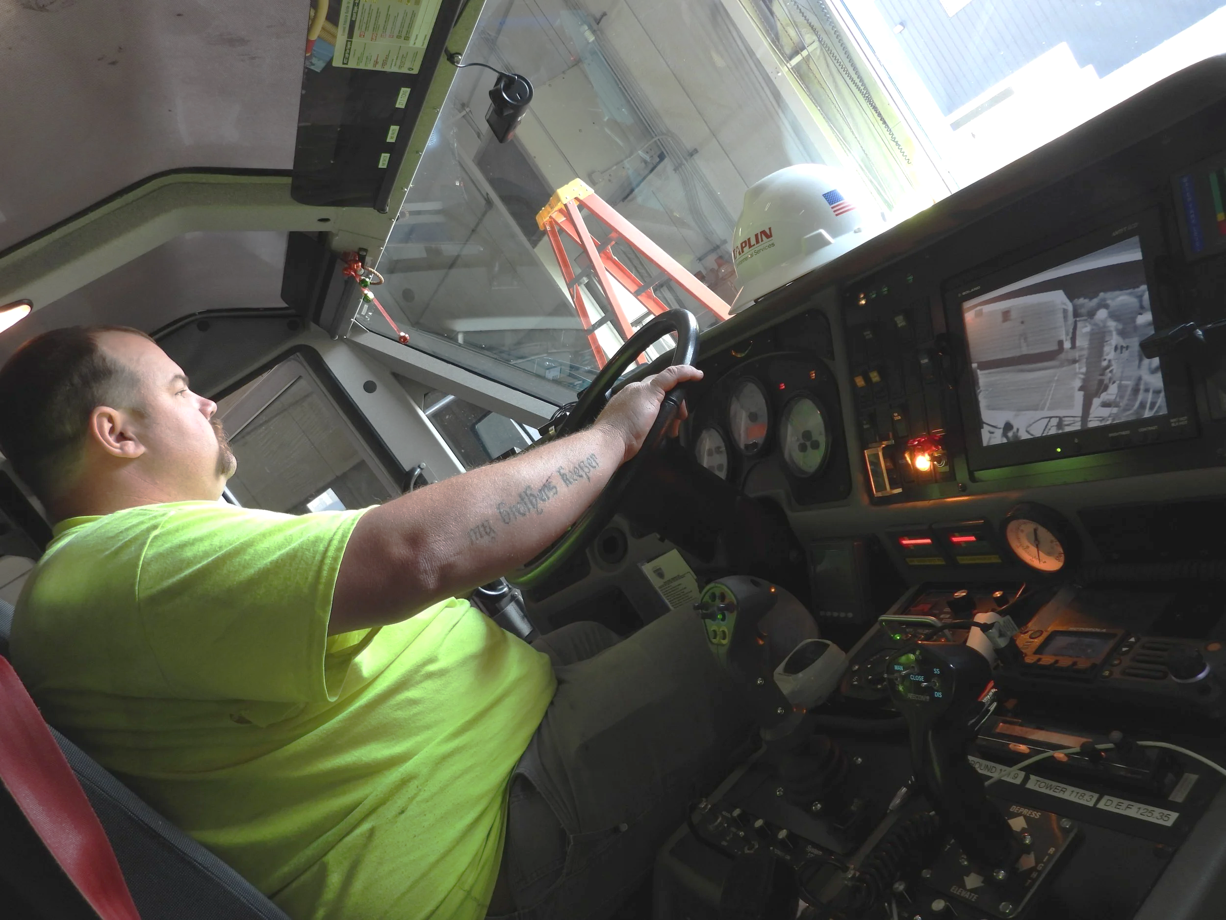 Firefighter on staff helping to operate equipment while treating for PFAS