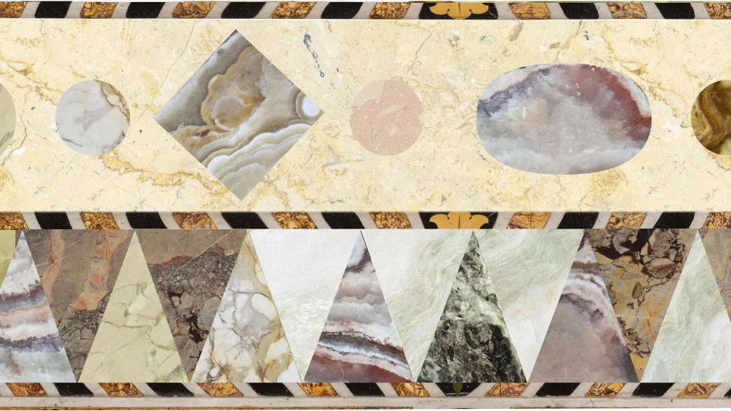 Close-up of a decorative marble or stone surface with various geometric shapes, including circles, squares, and triangles, in different colors and patterns.