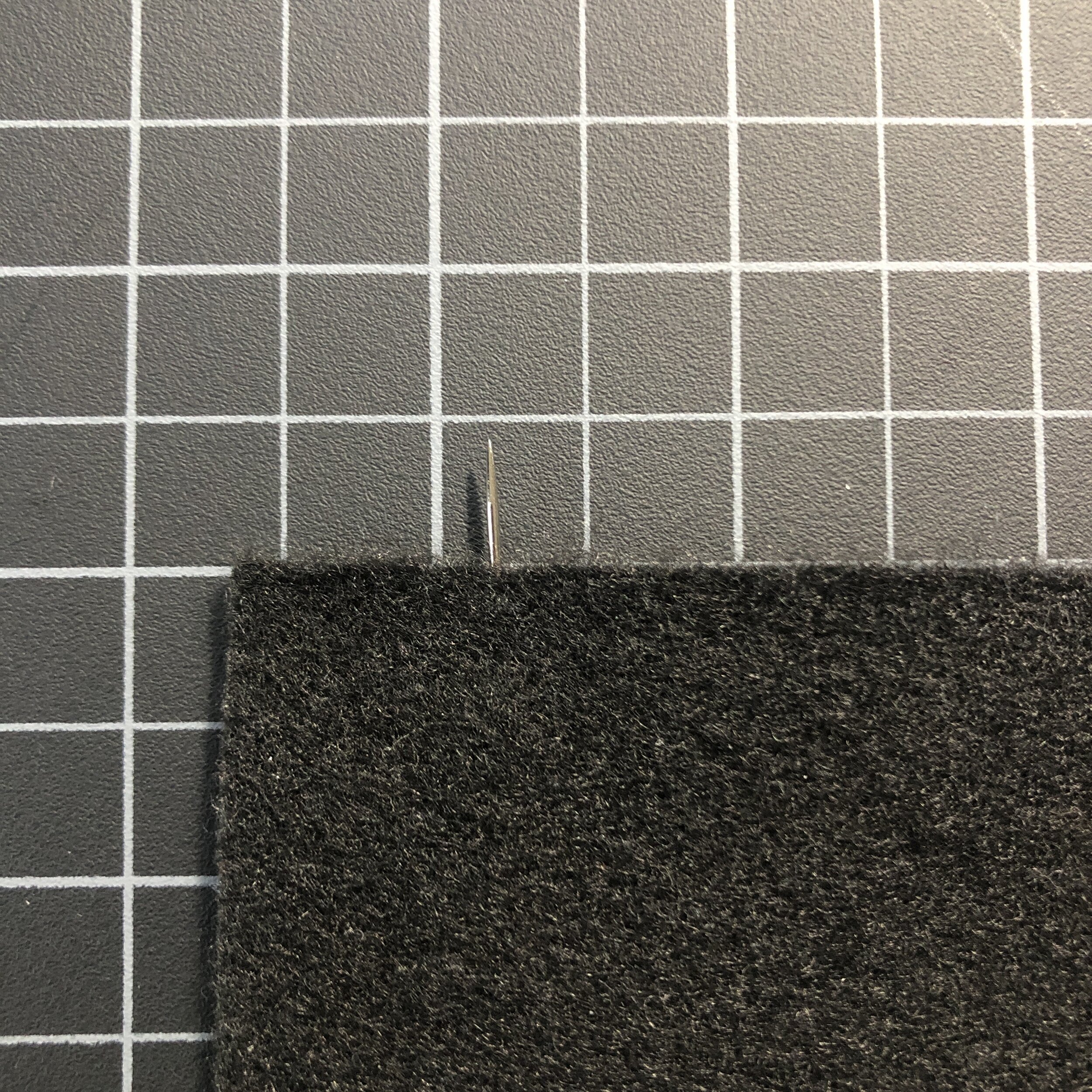  Here is the needle poking out from the edge of the felt (from the other side). 