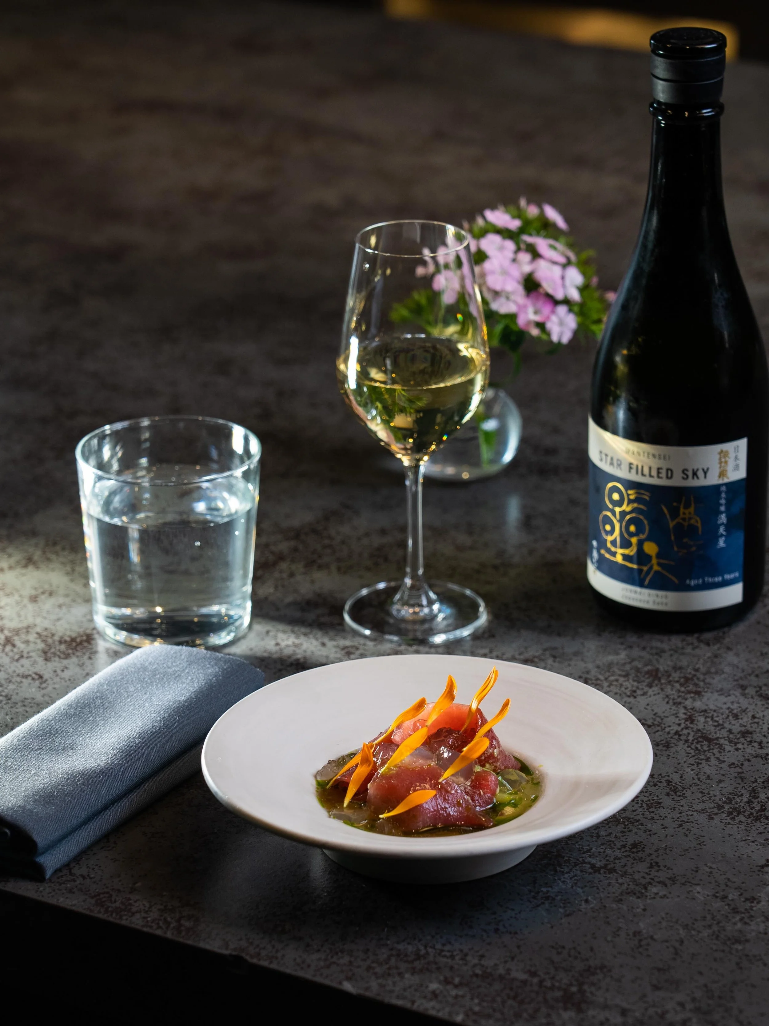 Land of the Rising Sun.

Bluefin Tuna | Strawberry | Negi Soya | Sake

Paired with Star Filled Sky Junmai Daiginjo, aged in tank for three years to develop depth, minerality, and a dry, polished finish that moves alongside the richness of bluefin and