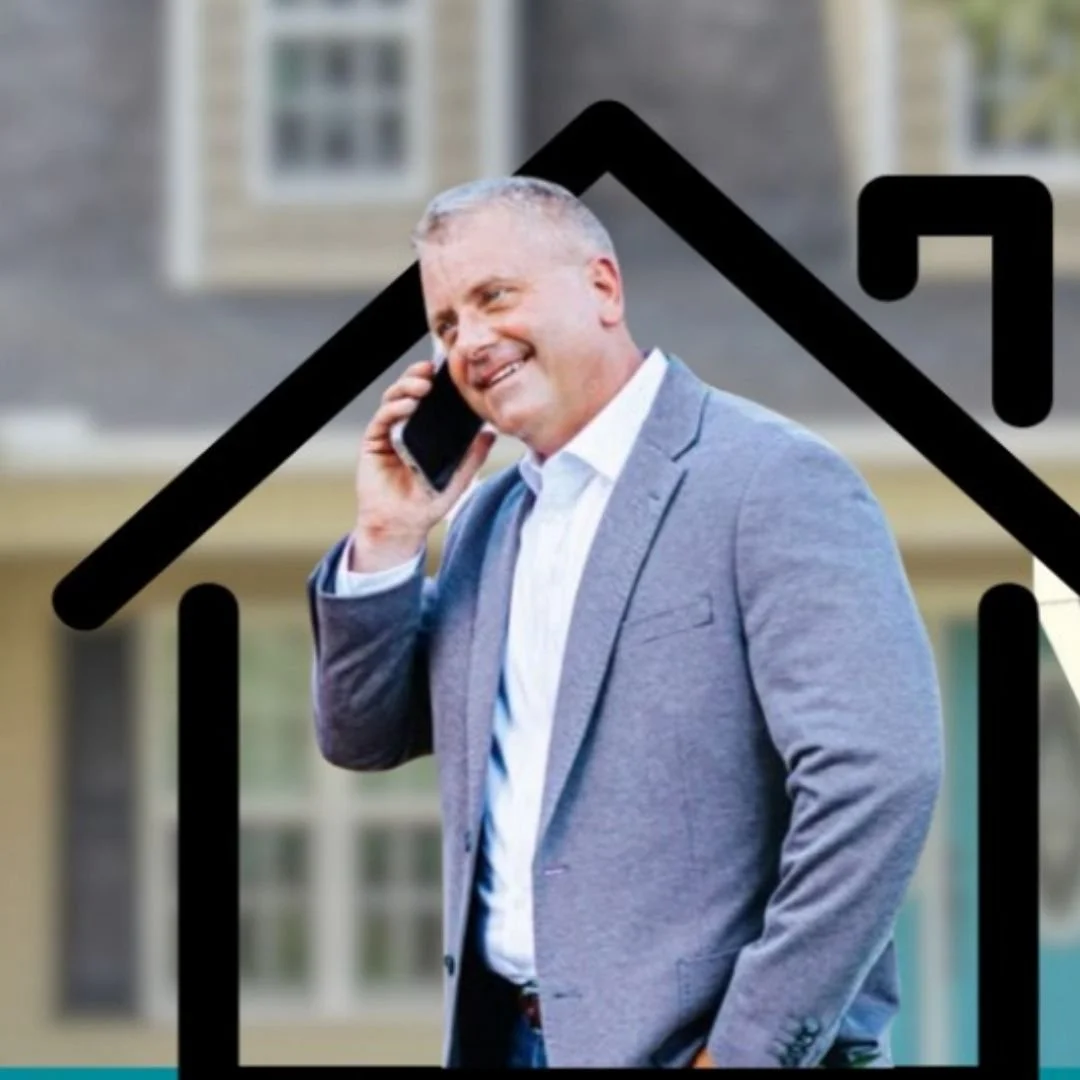 A confident woman with shoulder-length black hair, wearing a black short-sleeved top, a Gucci belt, and black pleated skirt, standing with arms crossed in front of a wood-paneled wall with a TV in the background.