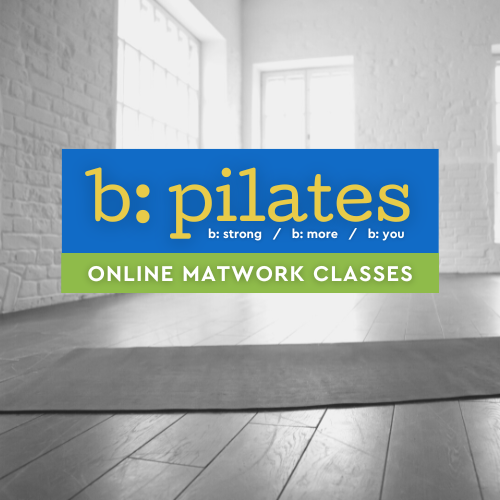 Sign for b: pilates online matwork classes in a bright, empty room with large windows and wooden floors.