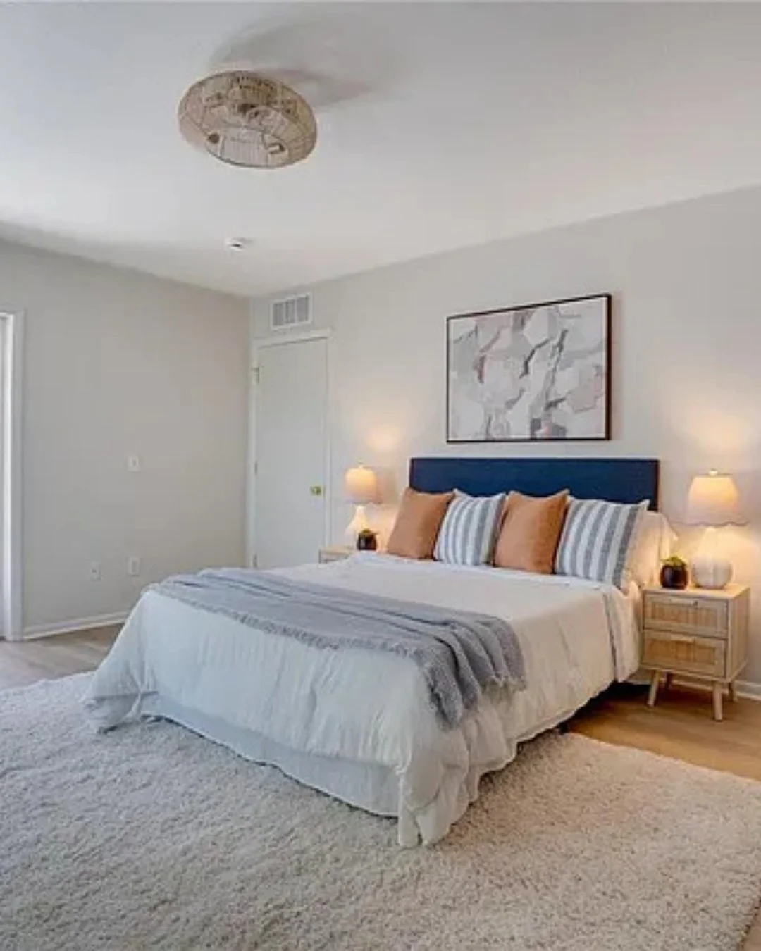 Why does an empty room cost a seller money?

Because buyers aren't great at imagining. Ask someone to picture a sofa, a rug, a place to eat dinner in a blank room, and most of them just... can't. They walk out remembering "echoey and empty"