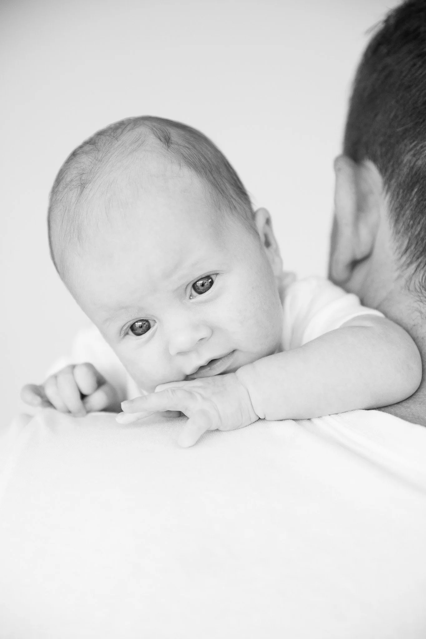 Snuggle Pix Family Photographer | A black and white portrait of a newborn baby's face | Noosa | Sunshine Coast | Brisbane.jpg