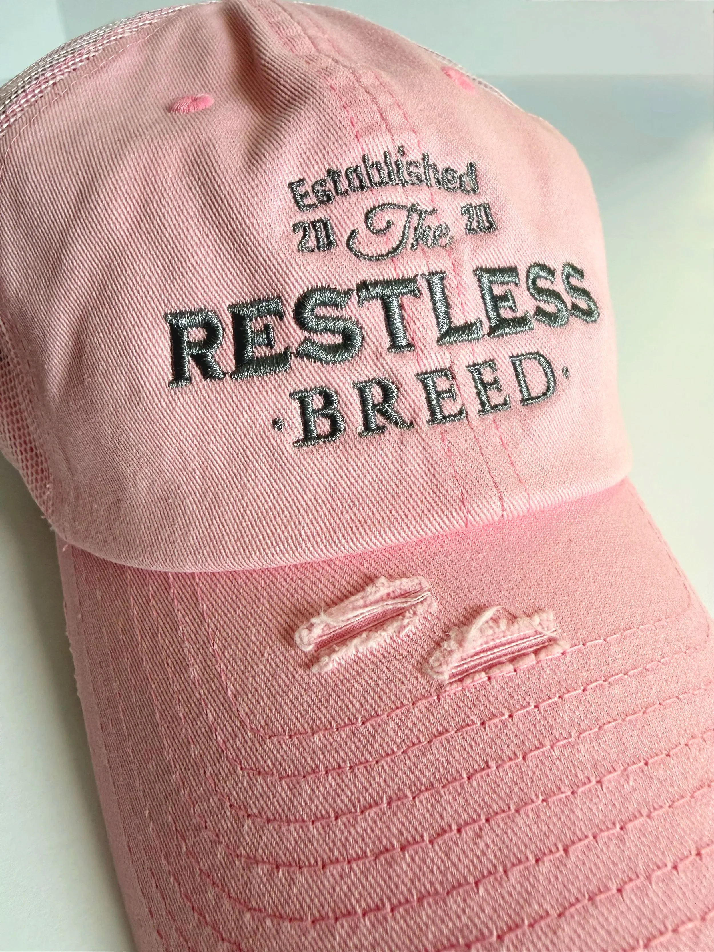 pink restless breed distressed baseball hat
