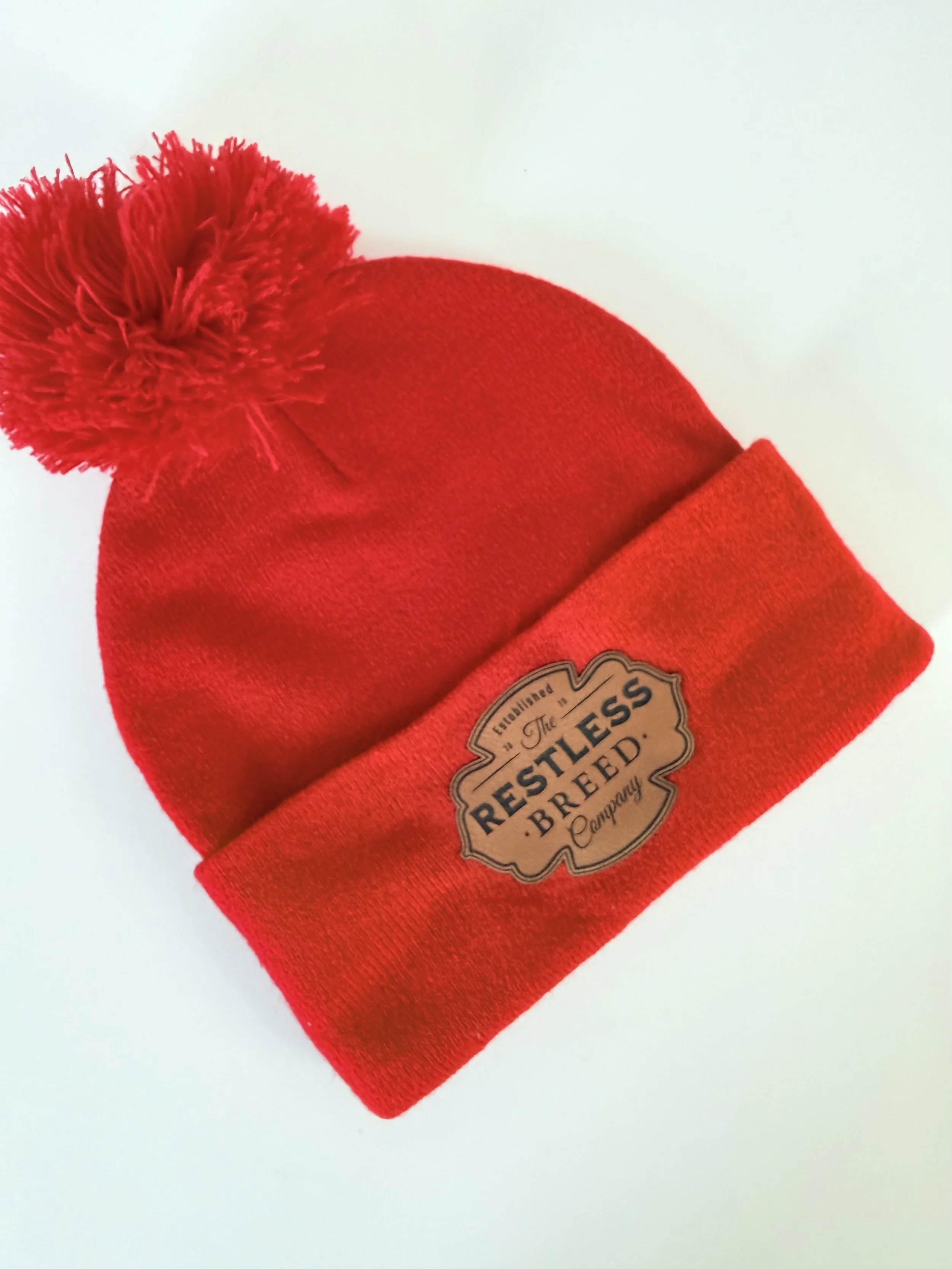 red ski hat with pom pom