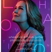A woman with wavy hair gazing upward, illuminated by vibrant neon lights forming the words 'LOVE' and 'HOPE', with additional text about a light and vision event in January 2023.