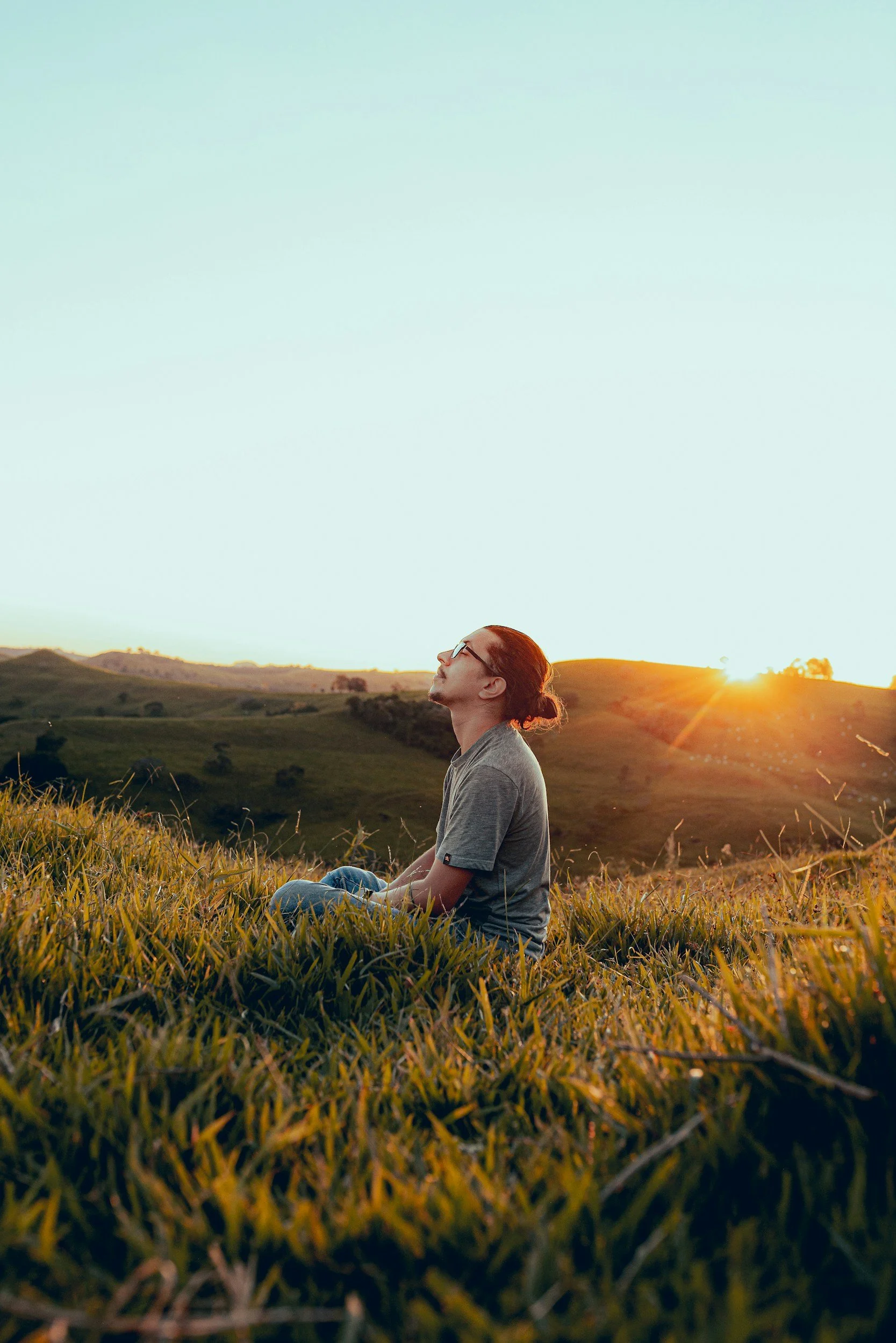 a person meditating in a field