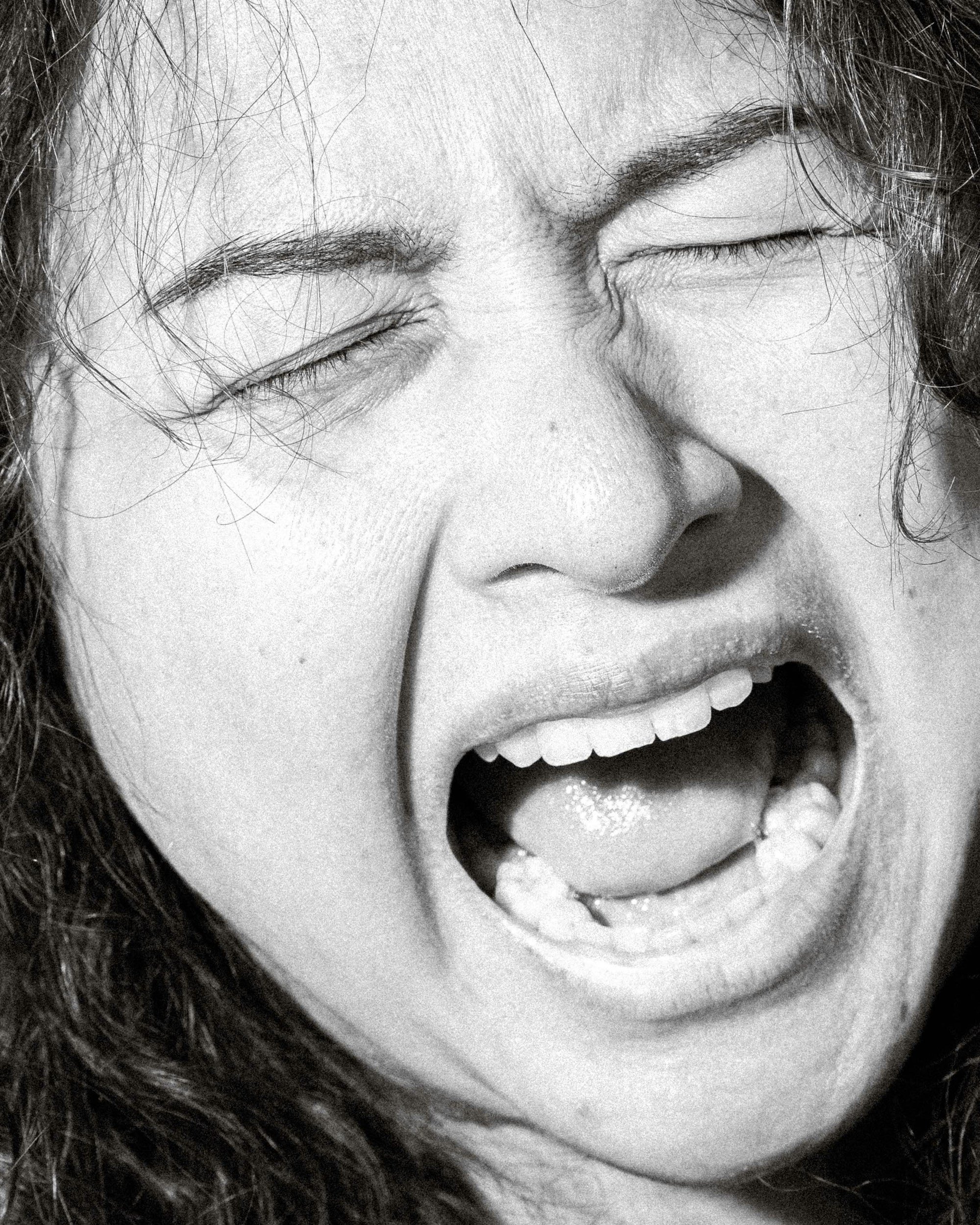 a black and white photo of a person yelling