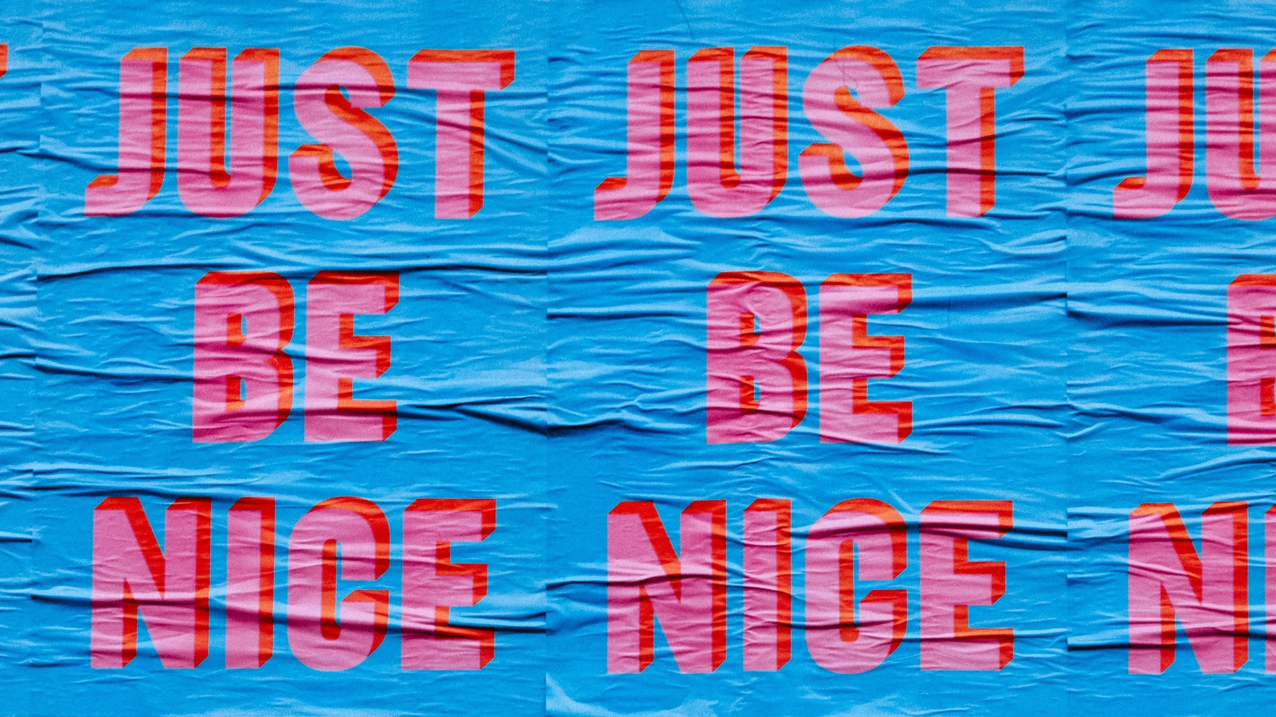posters with the words just be nice on them