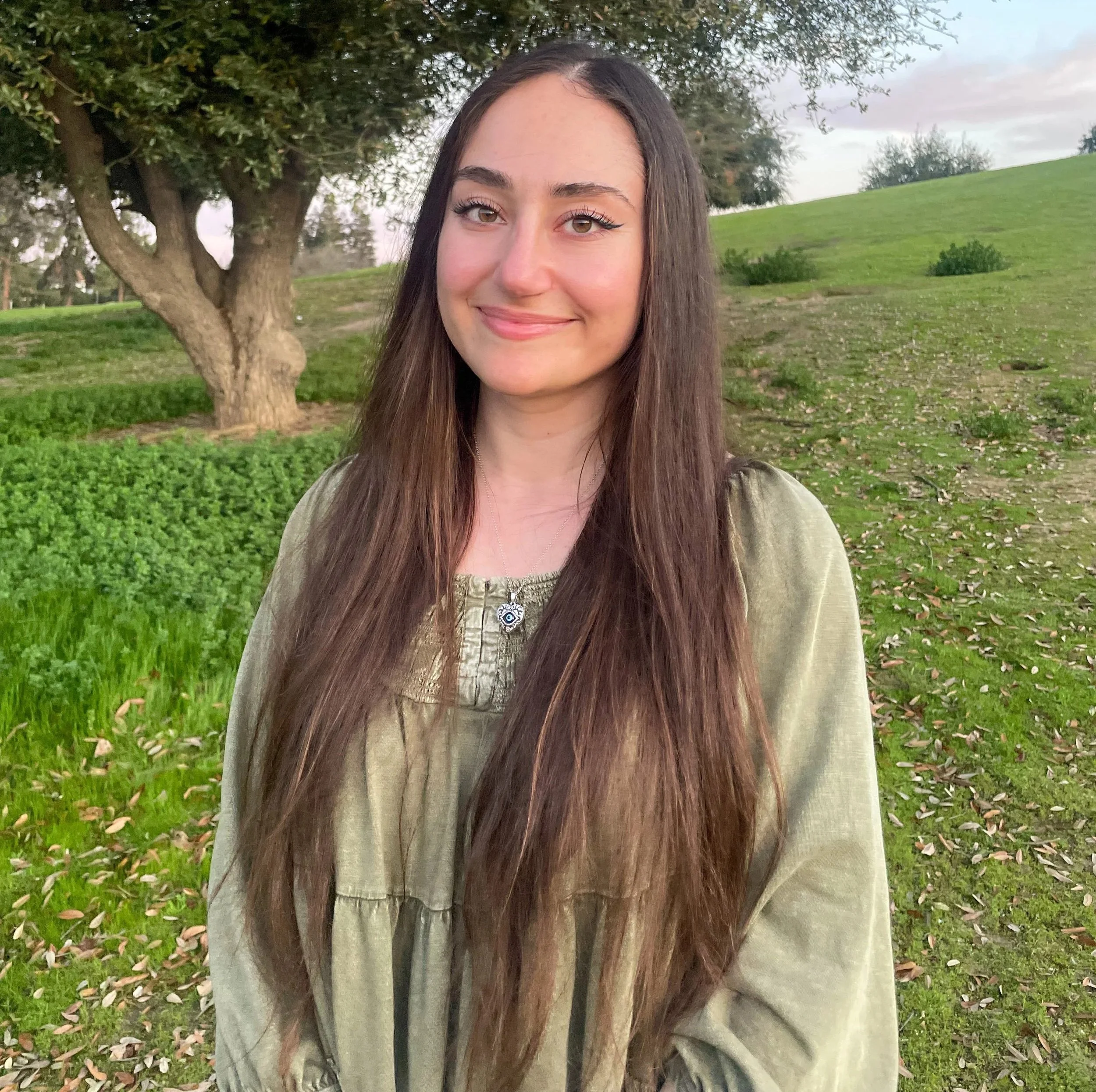 an image of Ashkhen Chamasanyan smiling at the camera