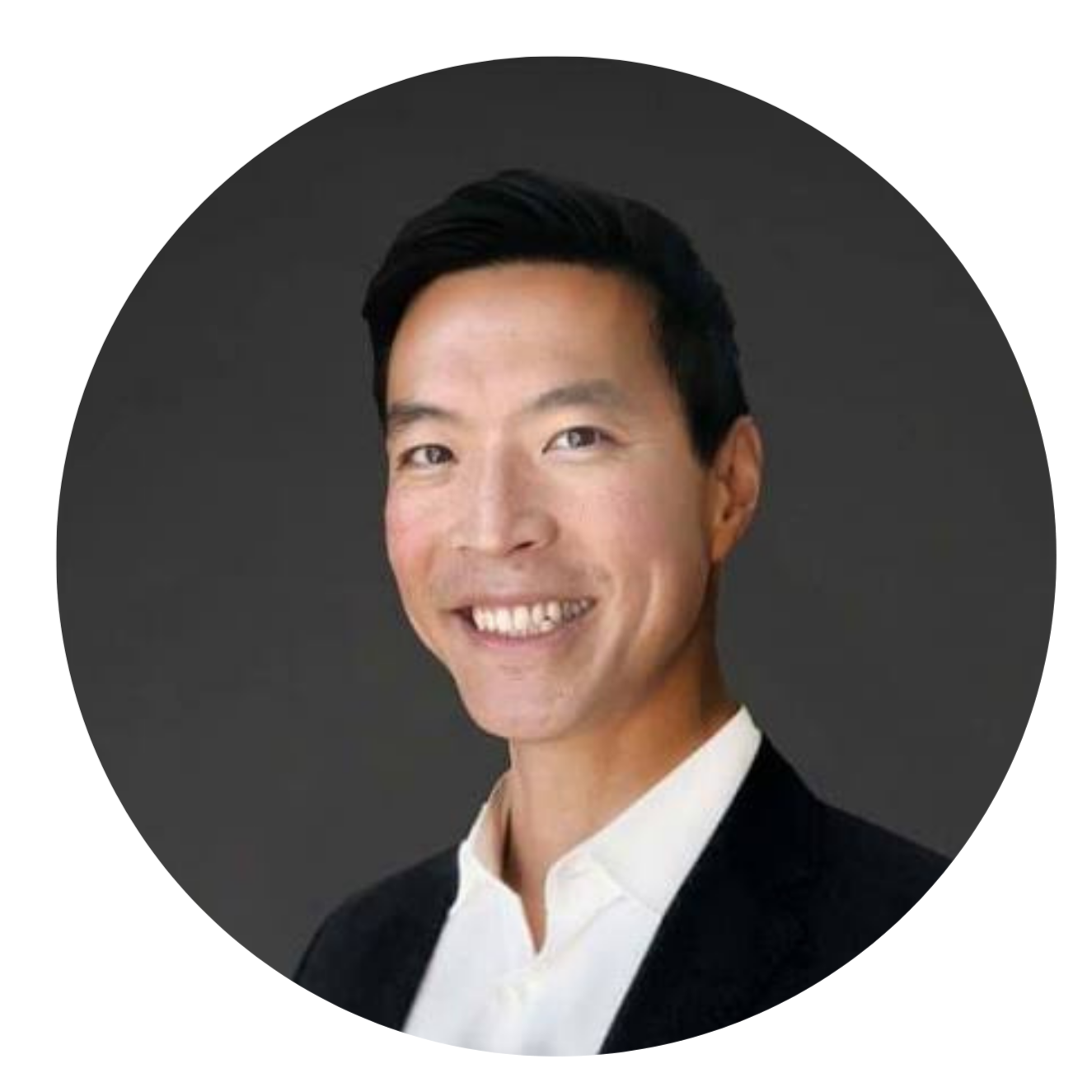 A professional headshot of Tony Fai from MESH Ventures, an investor with dark hair, wearing a black blazer and white shirt, against a dark gray background.