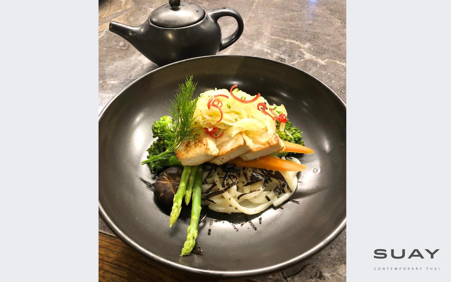 Grilled tofu steak with sautéed assorted vegetables served with Khao soi yellow curry from the north