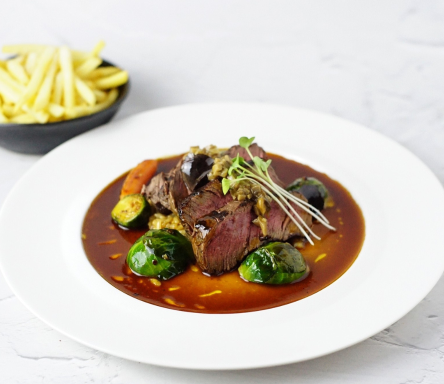 Charcoal grilled AUS beef tenderloin steak & porcini mushroom with water chestnut risotto, carrot and truffle jus