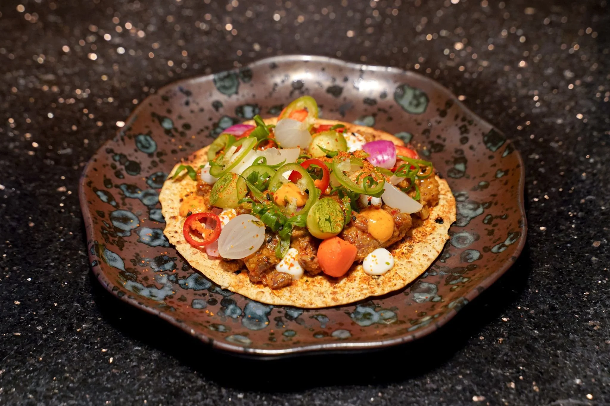 Asian Open-Face Beef Taco
Indonesian Beef Satay, Peanut Sauce & Homemade Pickles 
on Grilled Papadam
Азиатский тако с говядиной (открытый)
Индонезийский сатай из говядины с арахисовым соусом и домашними маринадами
на гриль-пападаме