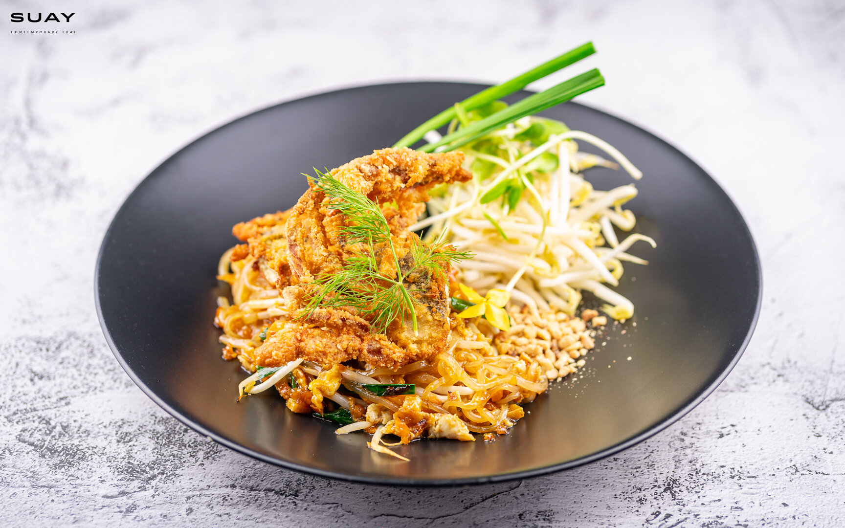 Signature pad Thai with crispy fried soft shell crab.